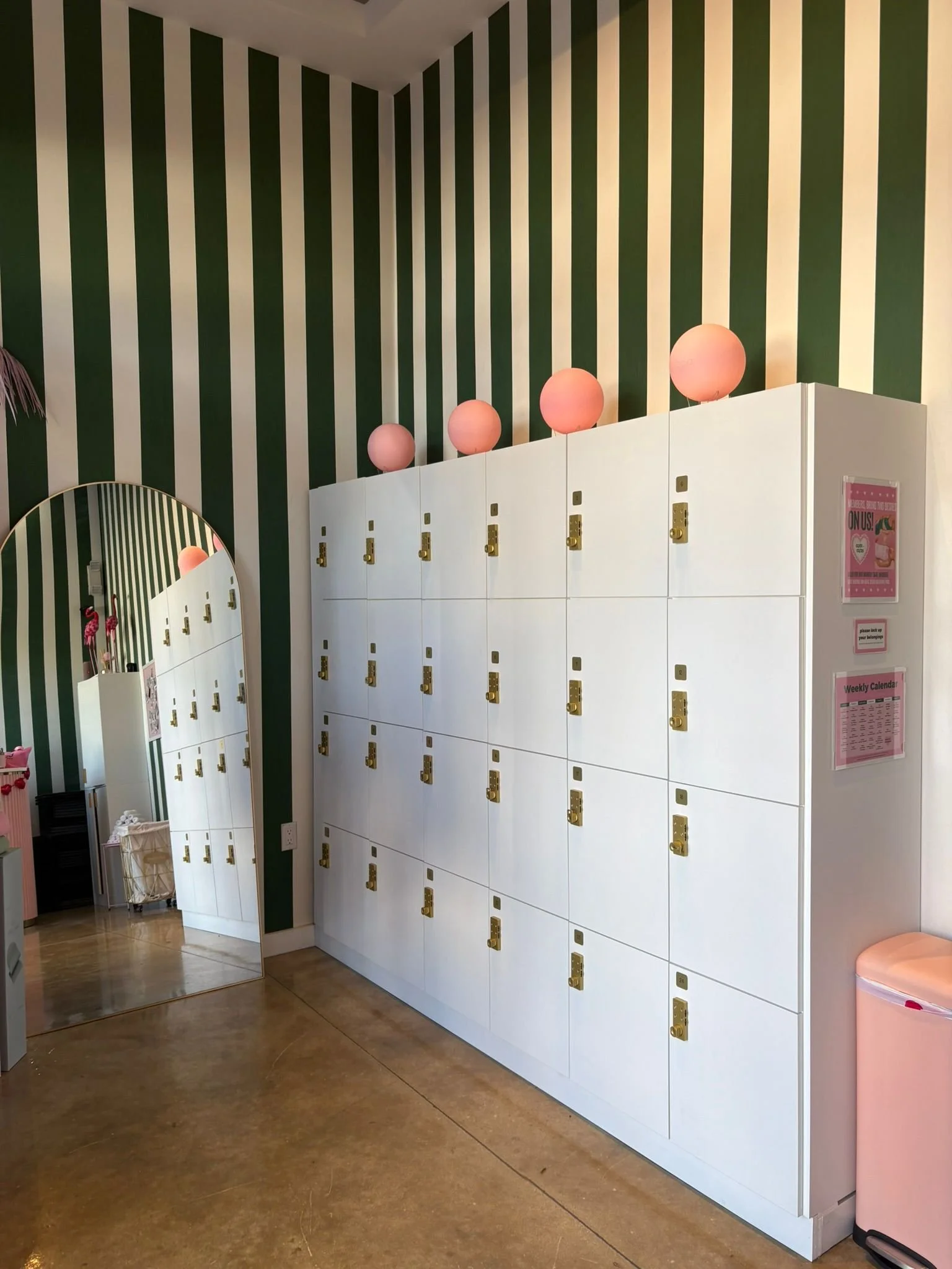 White lockers inside of a boutique fitness studio