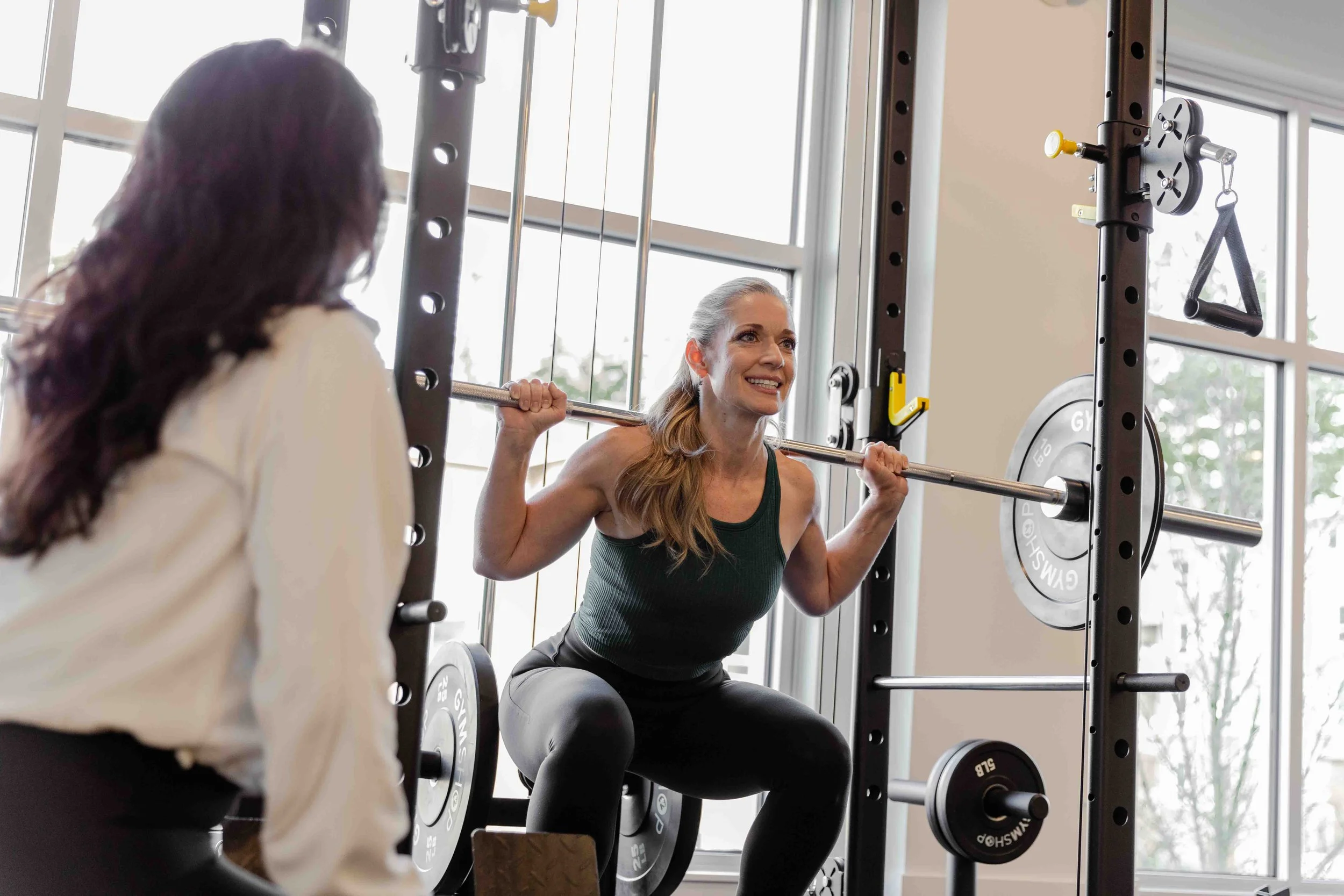 Barbell back squat during personal training session