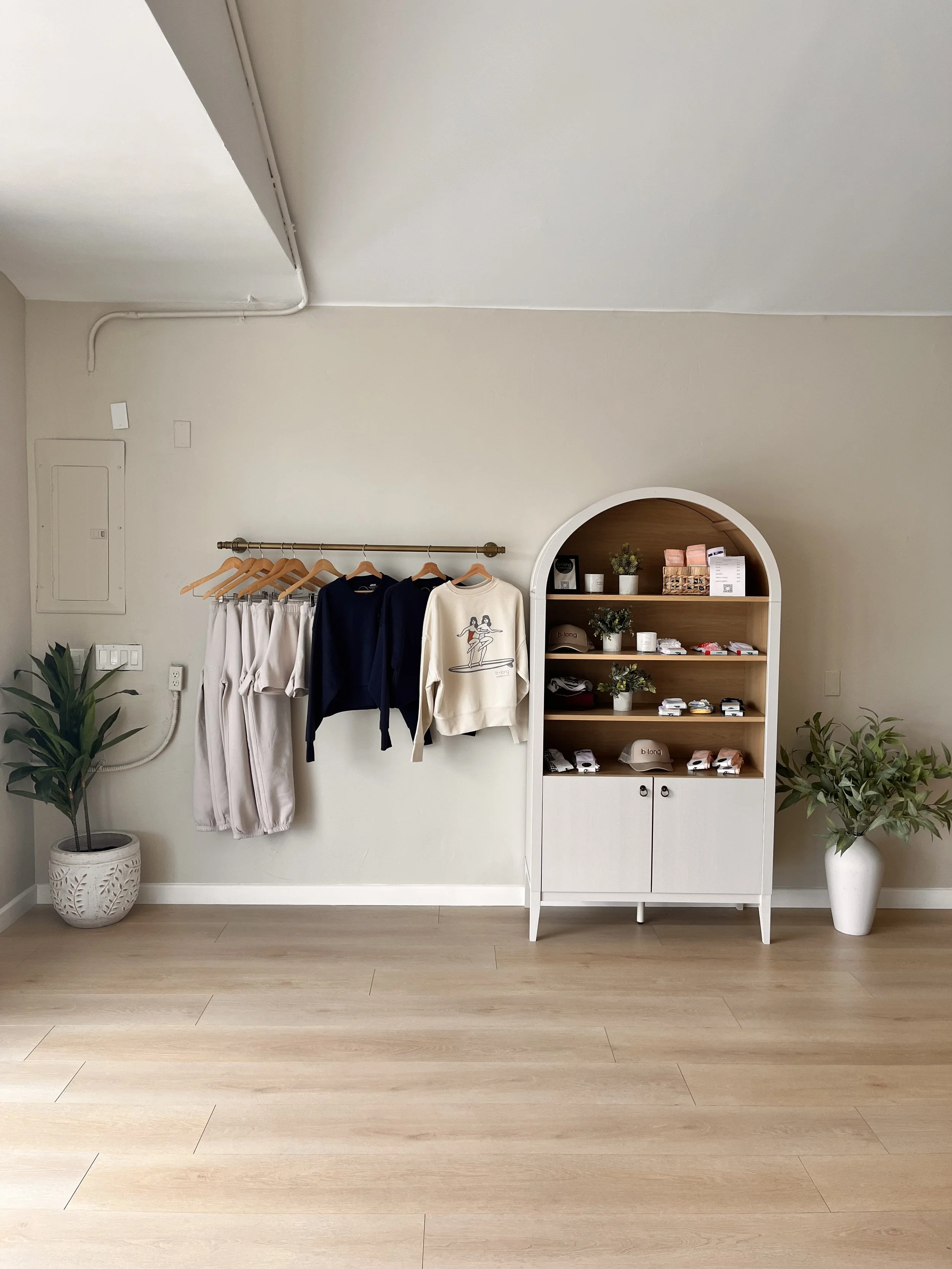 Sweatpants, sweaters and other merch in a fitness studio