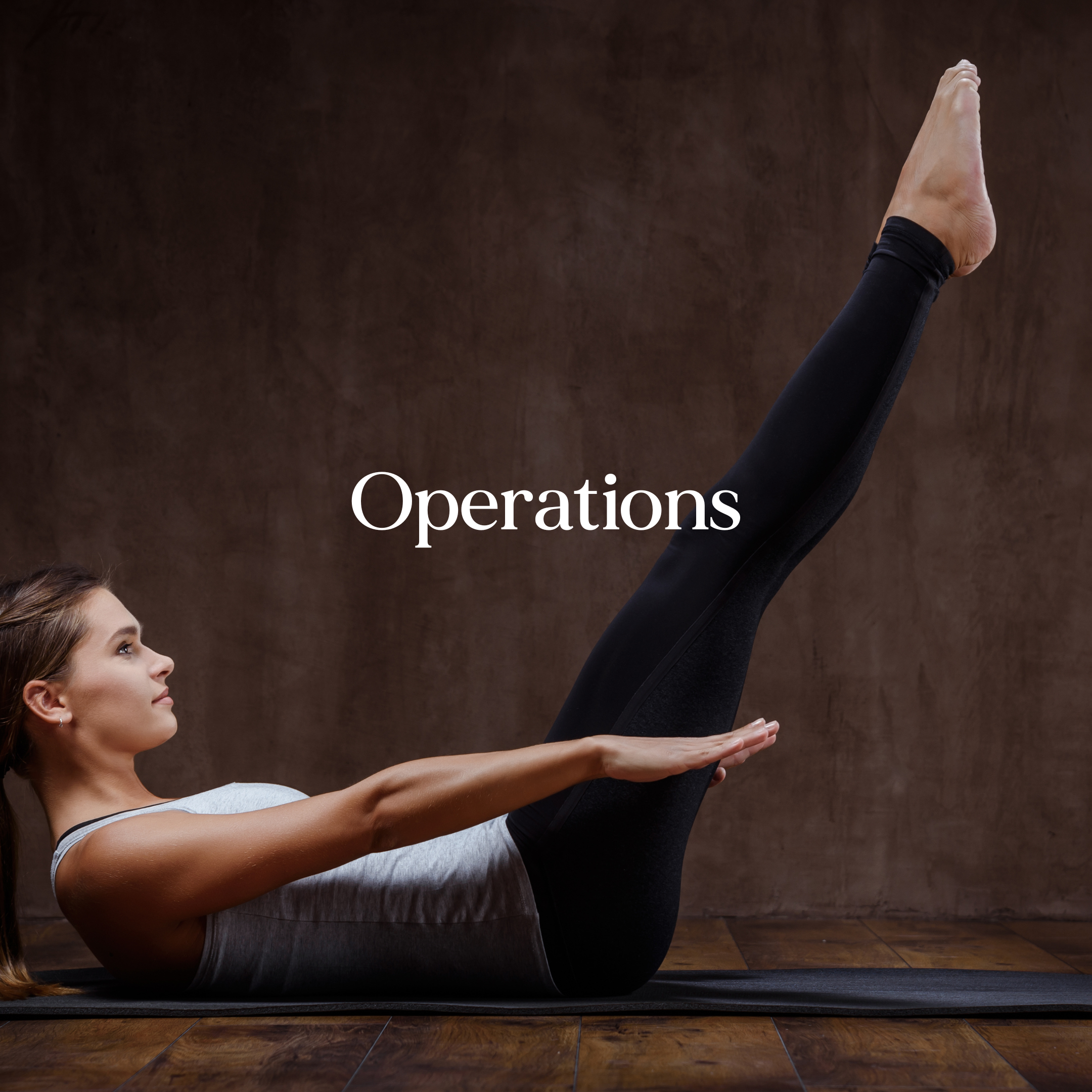 A woman and a girl practicing yoga together indoors, with the woman in an upward leg position and the girl lying on her stomach on a yoga mat, smiling at each other. The word "Operations" is overlaid.