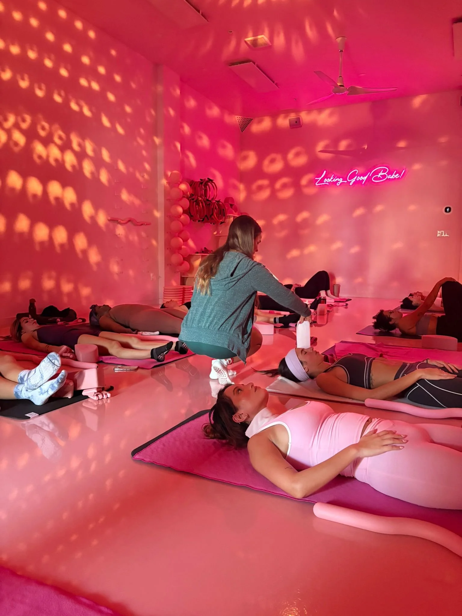 A group of woman during a hot yoga class at a Miami boutique fitness studio