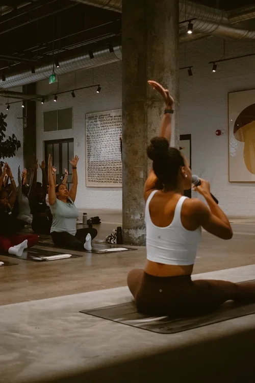 Yoga instructor leading a mat yoga class