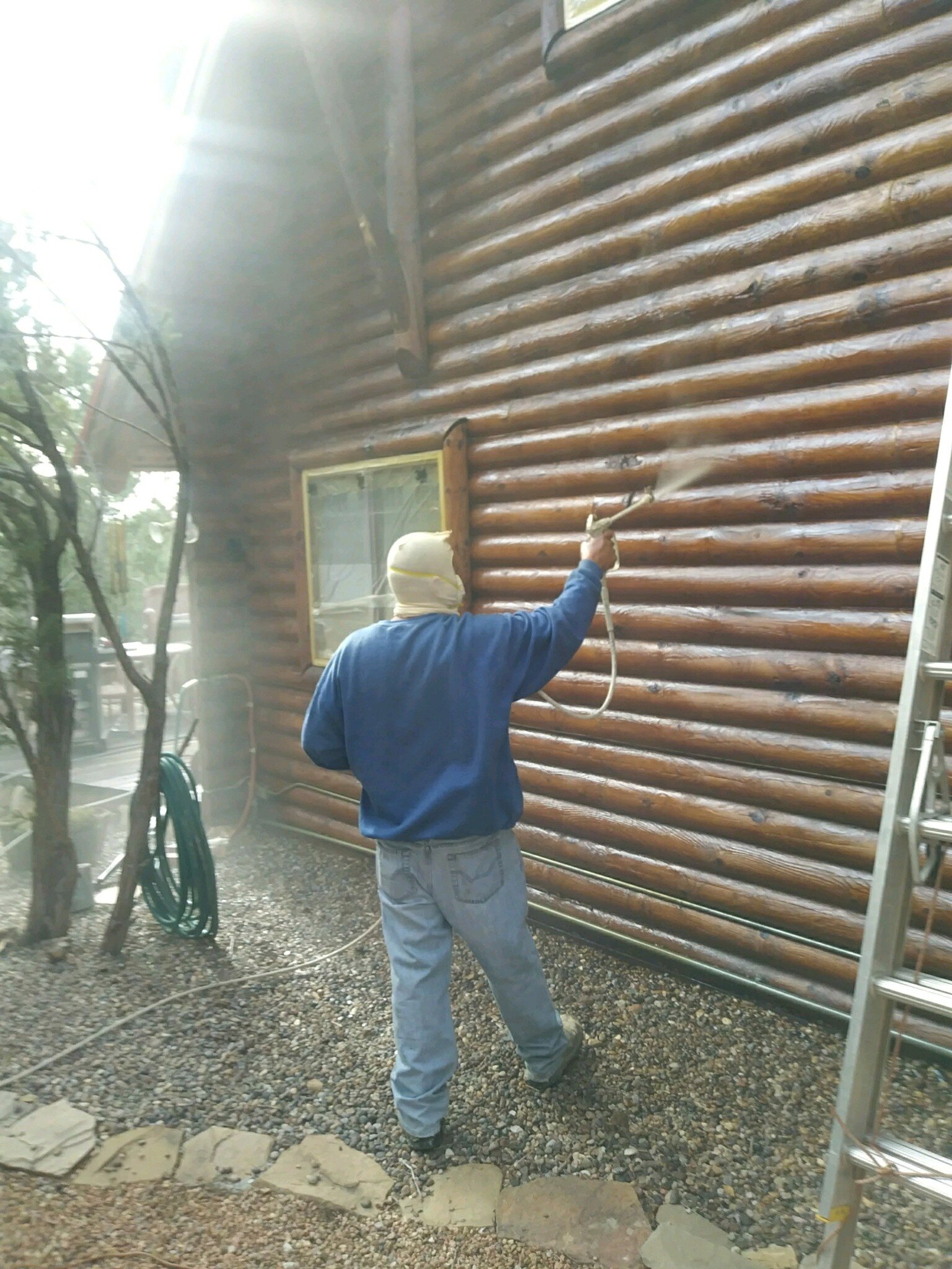 Larry spraying Hal Wilson's Home