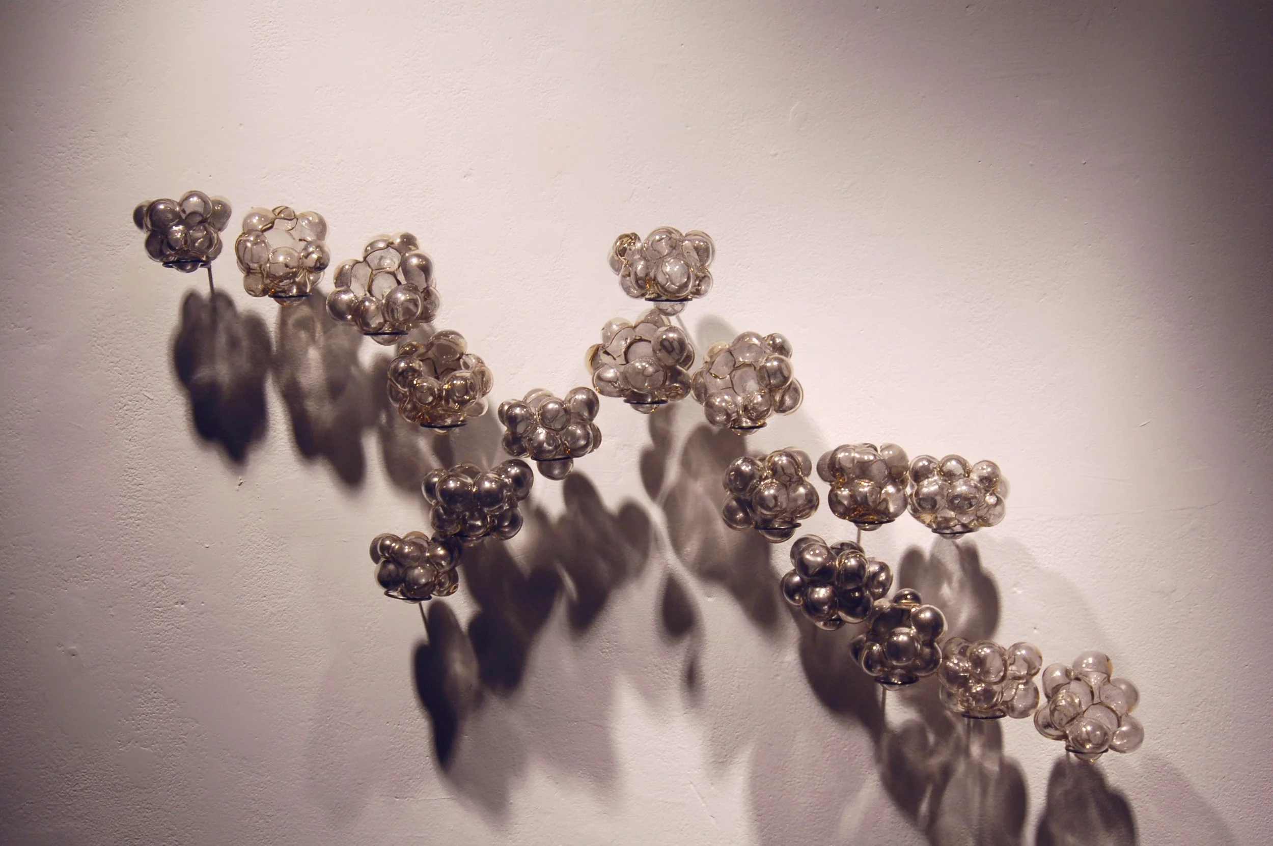 Linear, 
Blown Glass, Graphite Powder, Copper. 2'x4'x6", 2007.