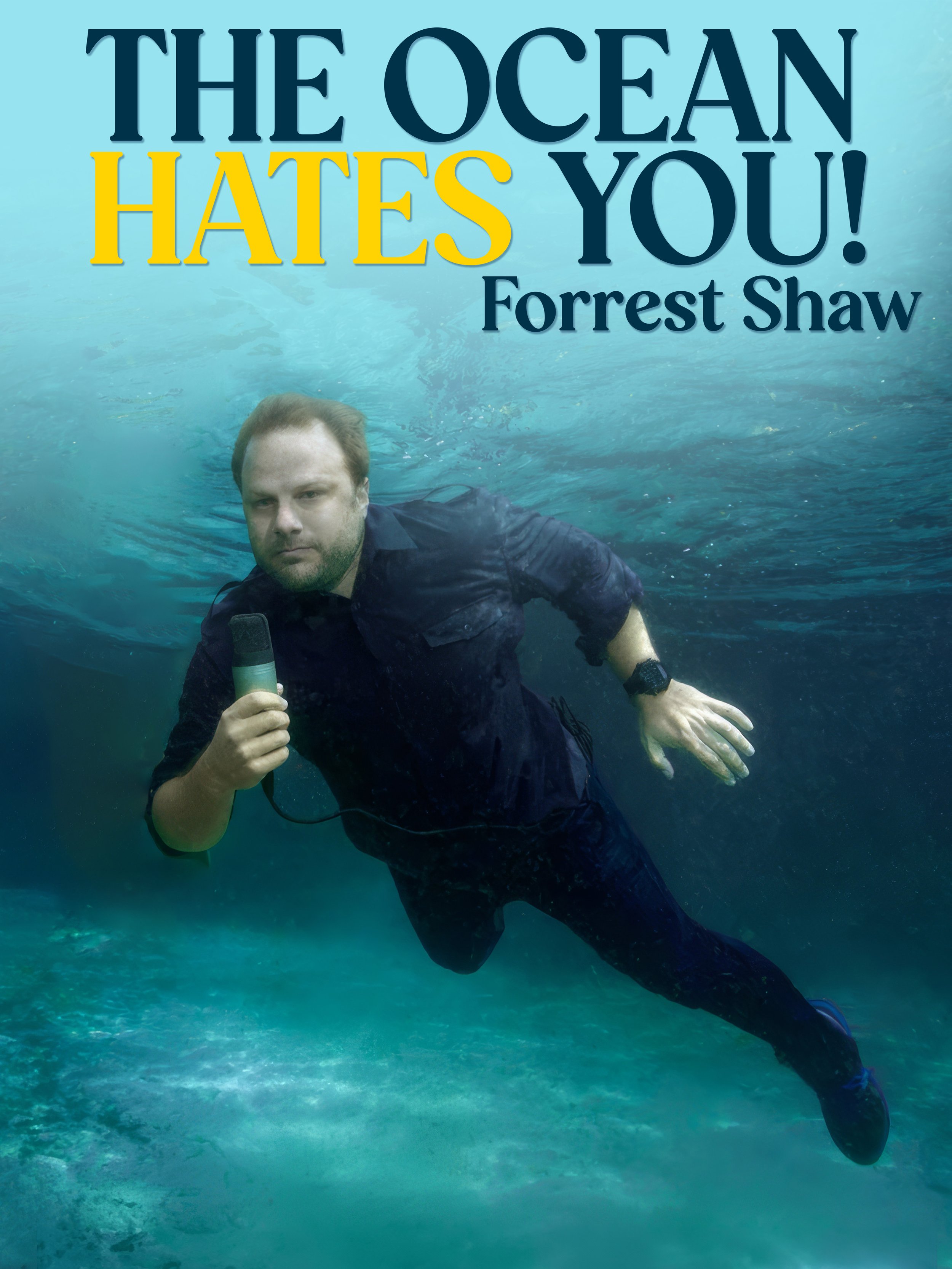 A man with red hair and a beard underwater, holding a microphone, with the text 'The Ocean Hates You! Forrest Shaw' in the background.