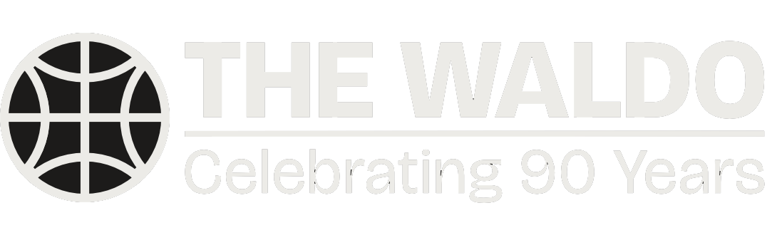 Logo for The Waldo celebrating 90 years, featuring a circular globe icon on the left and the text "THE WALDO" with "Celebrating 90 Years" underneath.