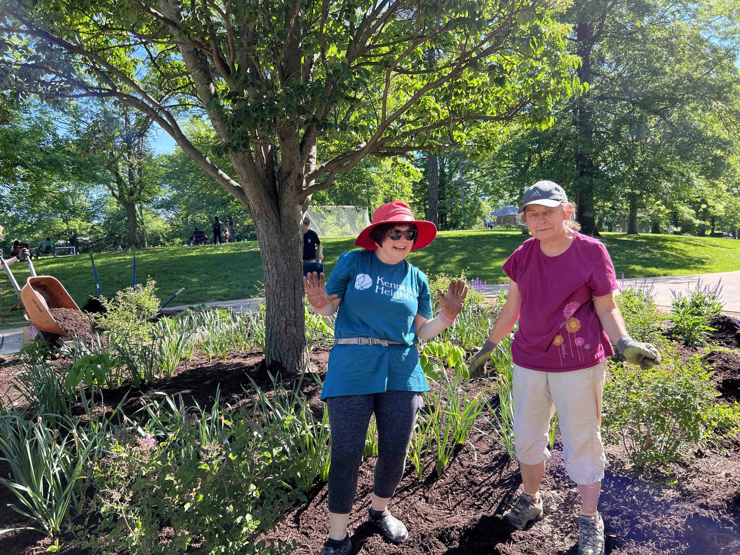 Neighbors working on cirle bed.jpg