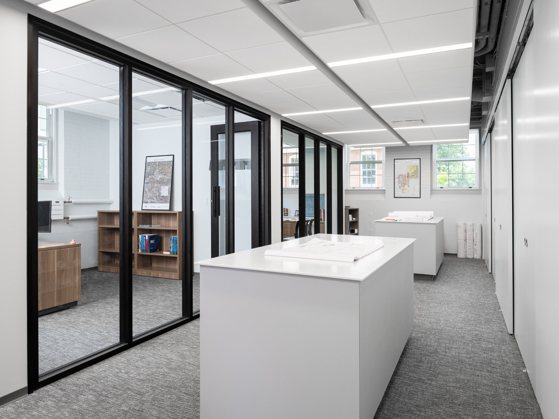 Des Peres City Hall interior open office with black-framed glass partition offices by Patterhn Ives, Des Peres Missouri - architectural photographer St. Louis