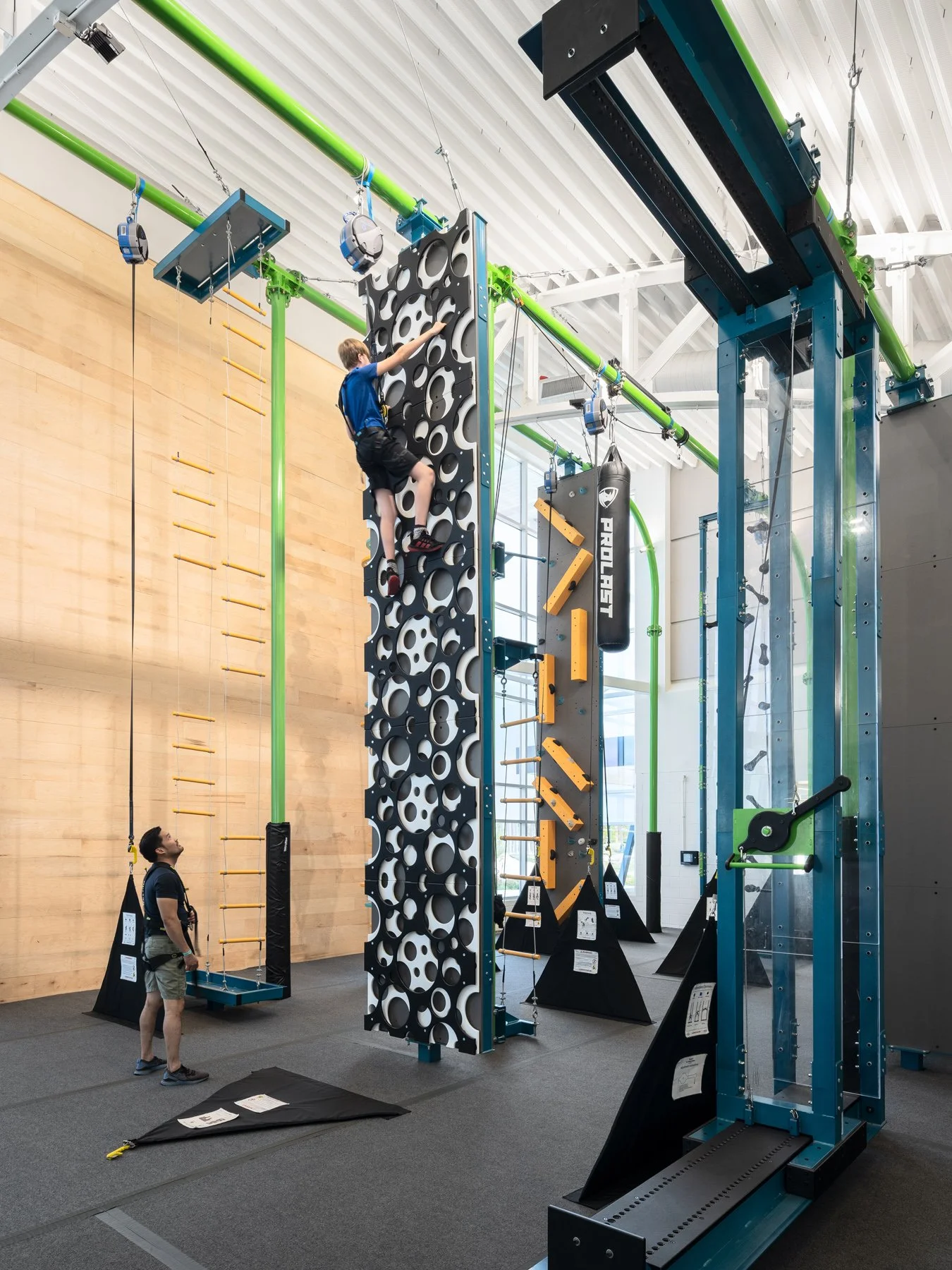Kinetic Park interior climbing wall and aerial adventure apparatus, by JEMA - architectural photographer St. Louis Missouri