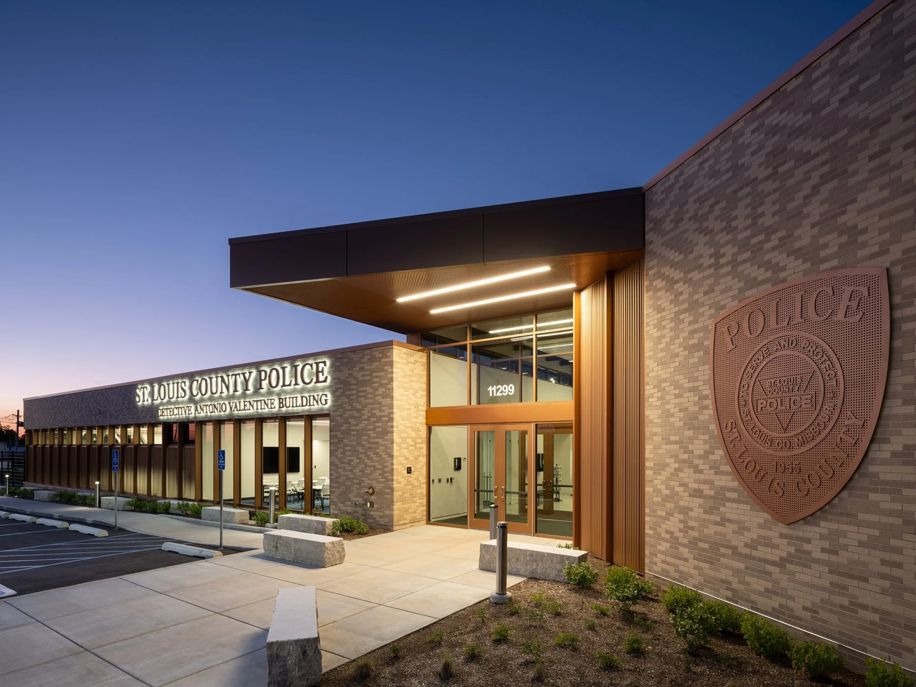 Detective Antonio Valentine Building entrance and badge at dusk by JEMA, Maryland Heights Missouri - architectural photographer St. Louis Missouri