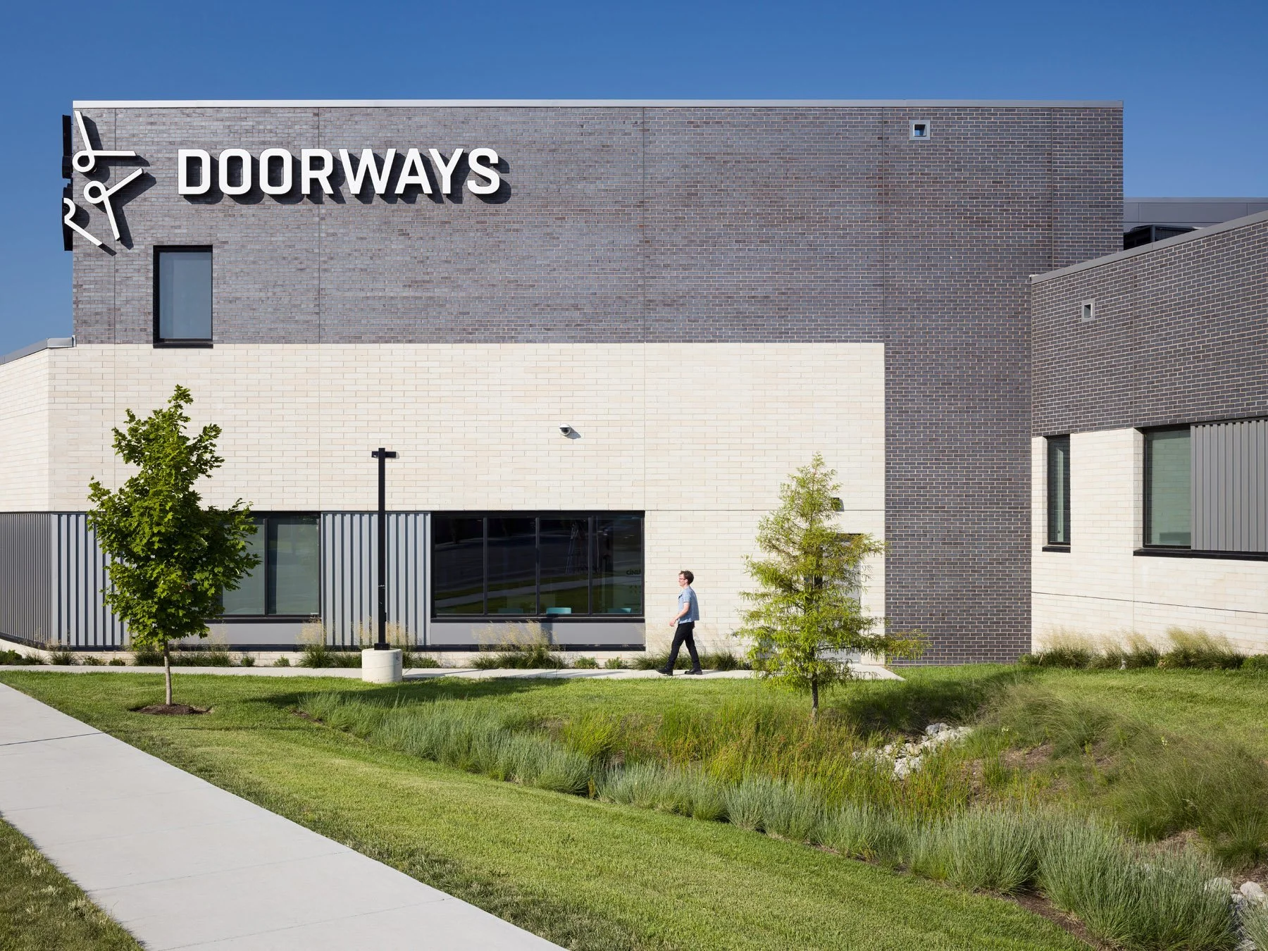 DOORWAYS administration building entry corner with brick facade, by Trivers - architectural photographer St. Louis Missouri