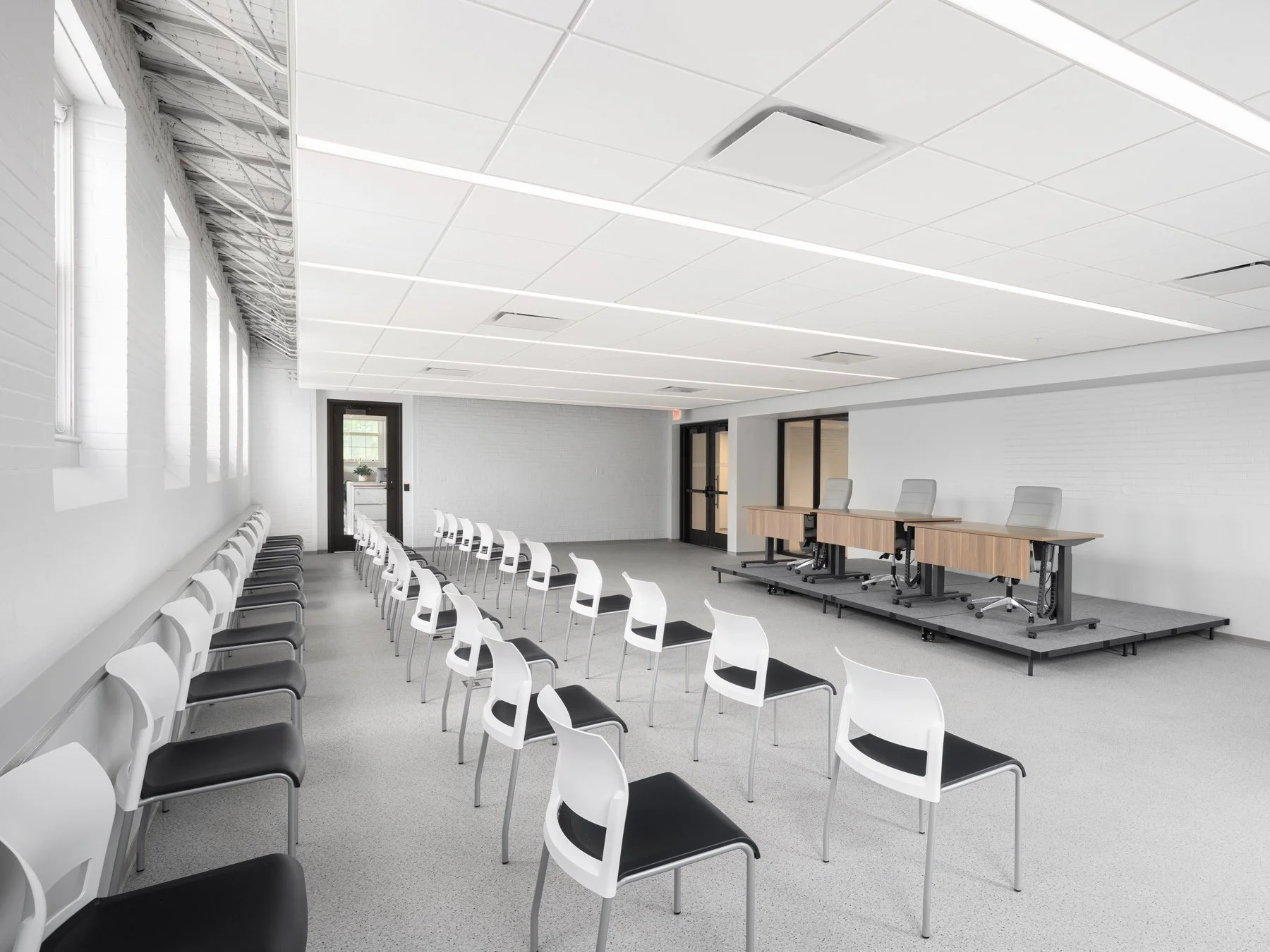 es Peres City Hall interior meeting room with white chairs and raised platform by Patterhn Ives, Des Peres Missouri - architectural photographer St. Louis
