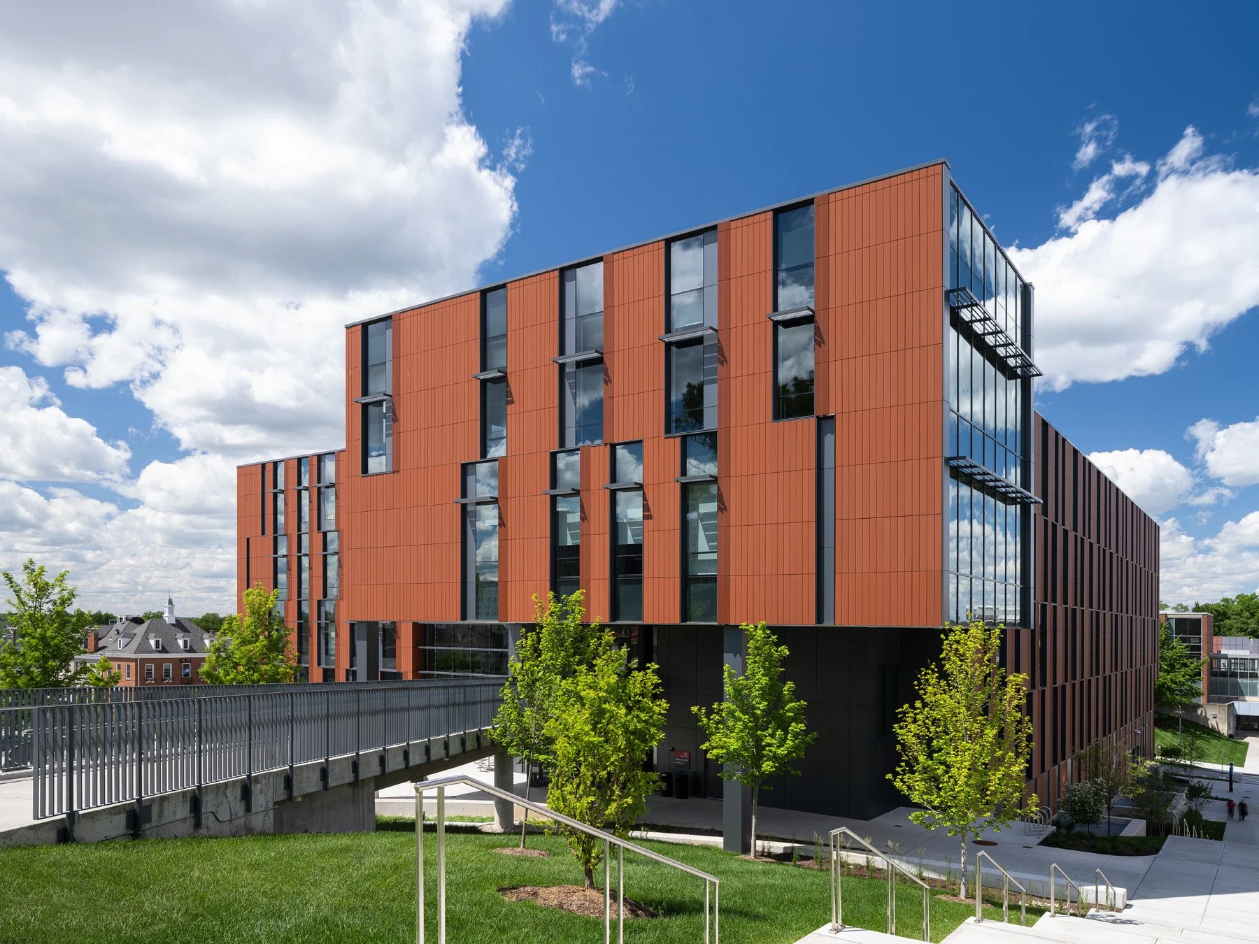 Clifton Court Hall terracotta exterior with elevated pedestrian bridge, by LMN Architects and KZF Design - architectural photographer Cincinnati Ohio