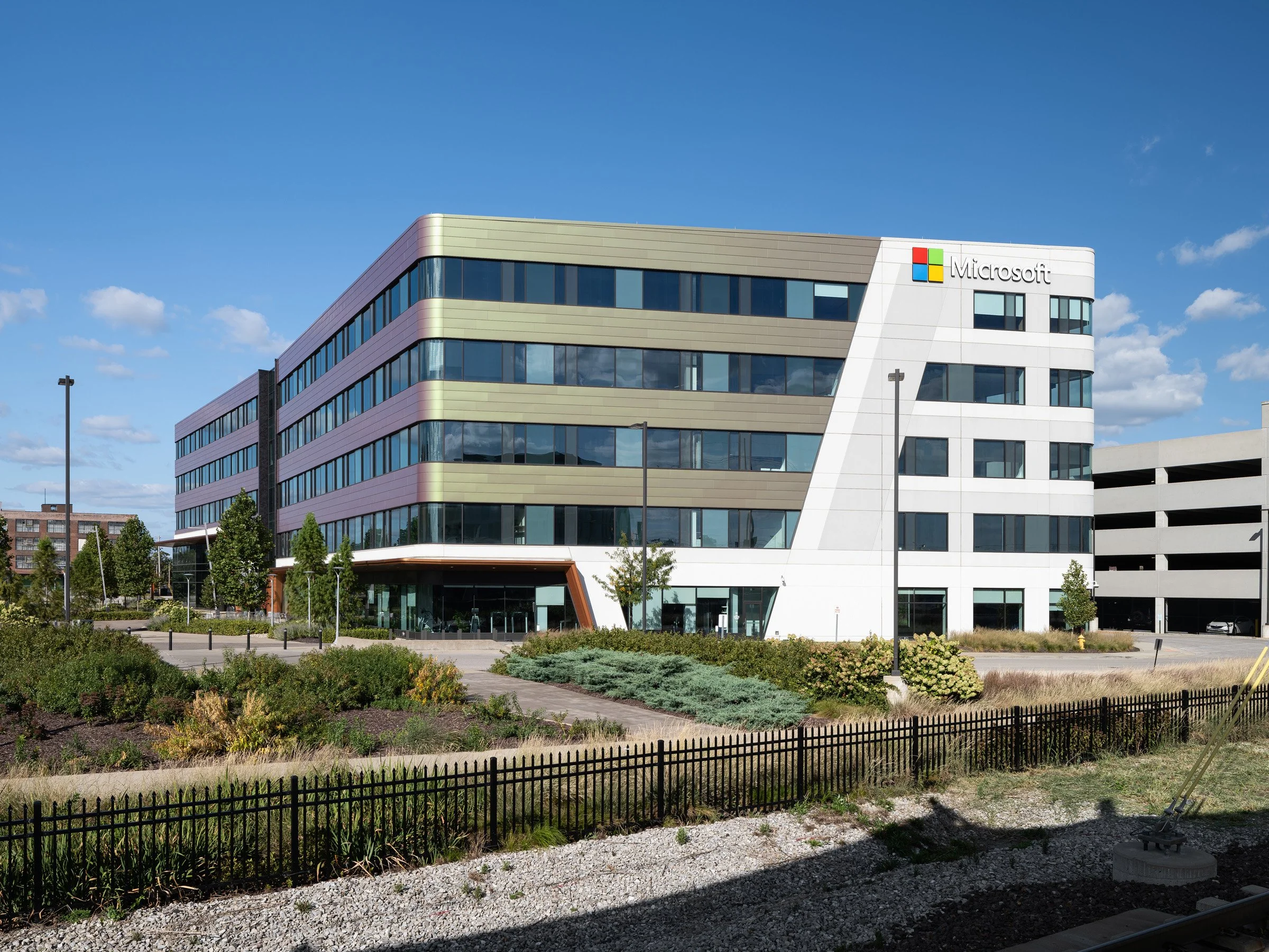 4220 Duncan three-quarter view with Microsoft signage and green-gold facade panels, by HOK - architectural photographer St. Louis Missouri