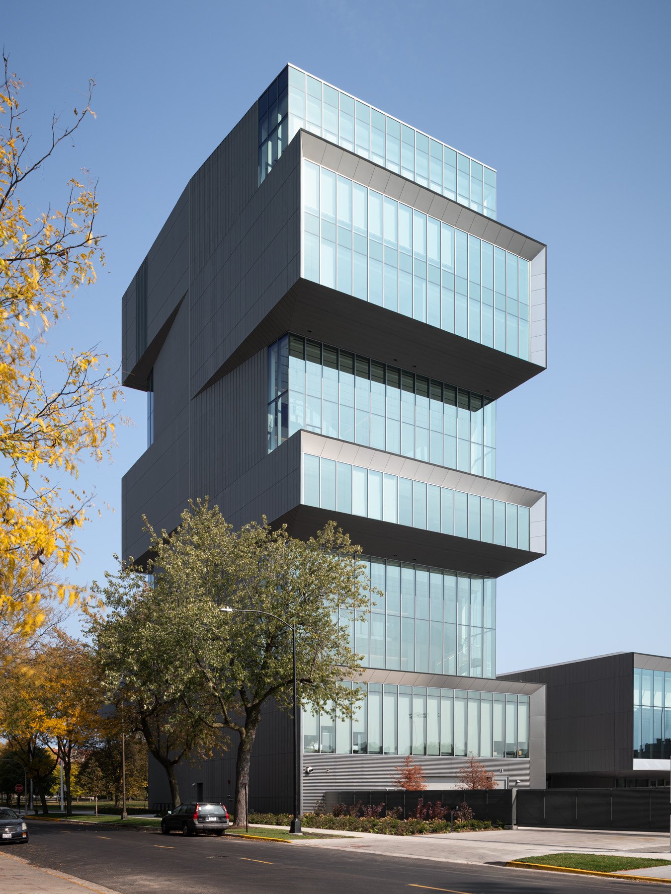 David Rubenstein Forum zinc and glass tower above the street in fall by Diller Scofidio + Renfro - architectural photographer Chicago Illinois