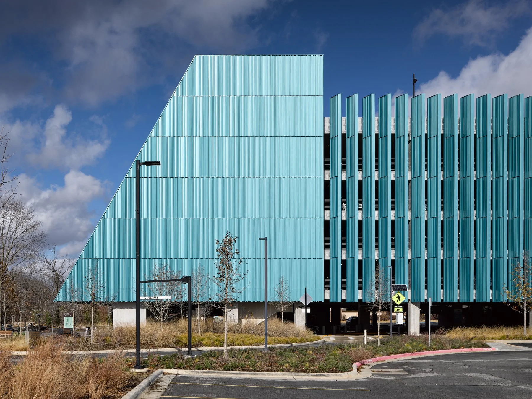 Crystal Bridges Parking sloped end wall meeting the spaced fin screen, by Marlon Blackwell - architectural photographer Bentonville Arkansas