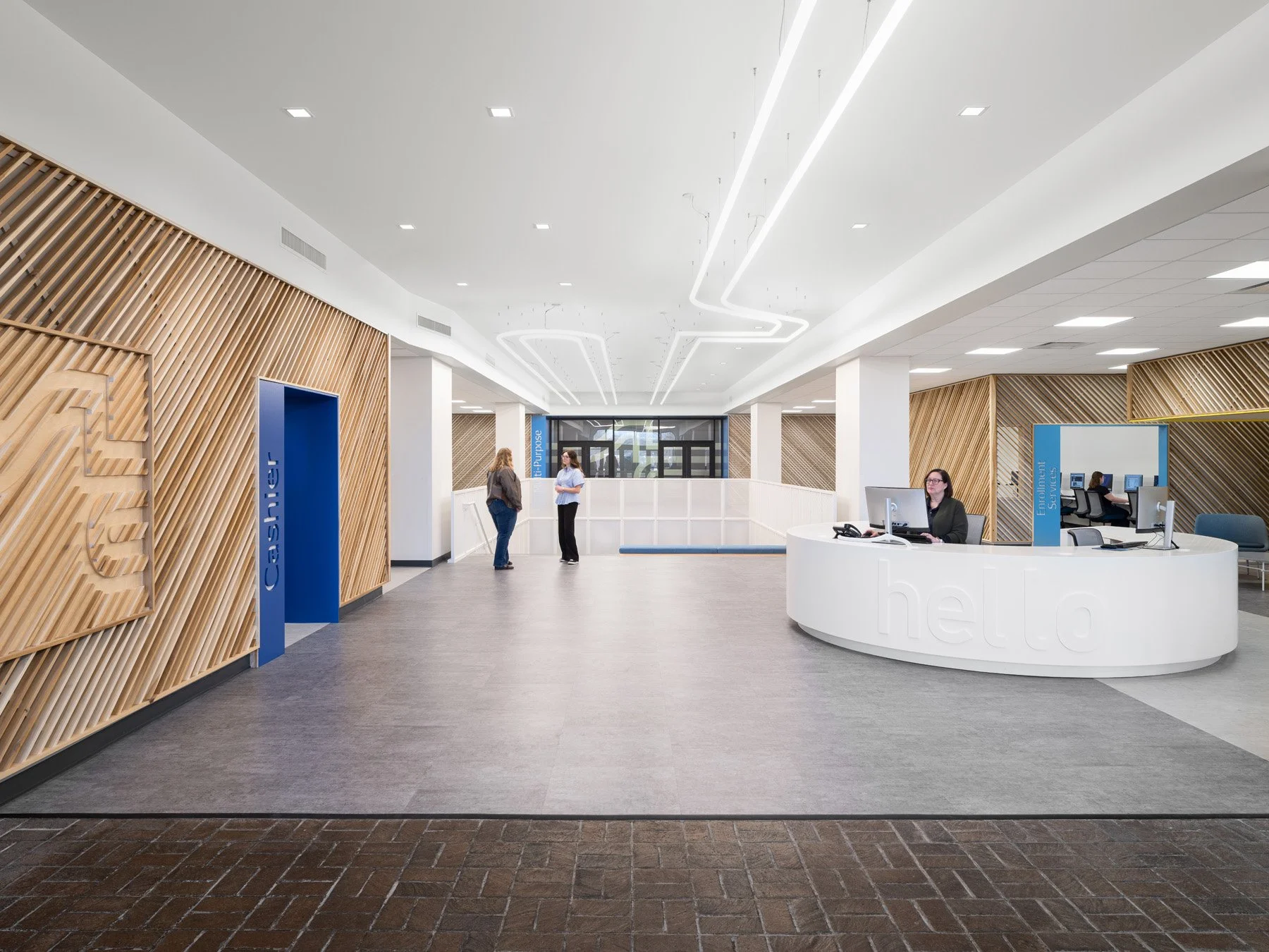 STLCC Florissant Valley Student Center curved reception desk and wood slat walls by JEMA, Ferguson Missouri - architectural photographer St. Louis