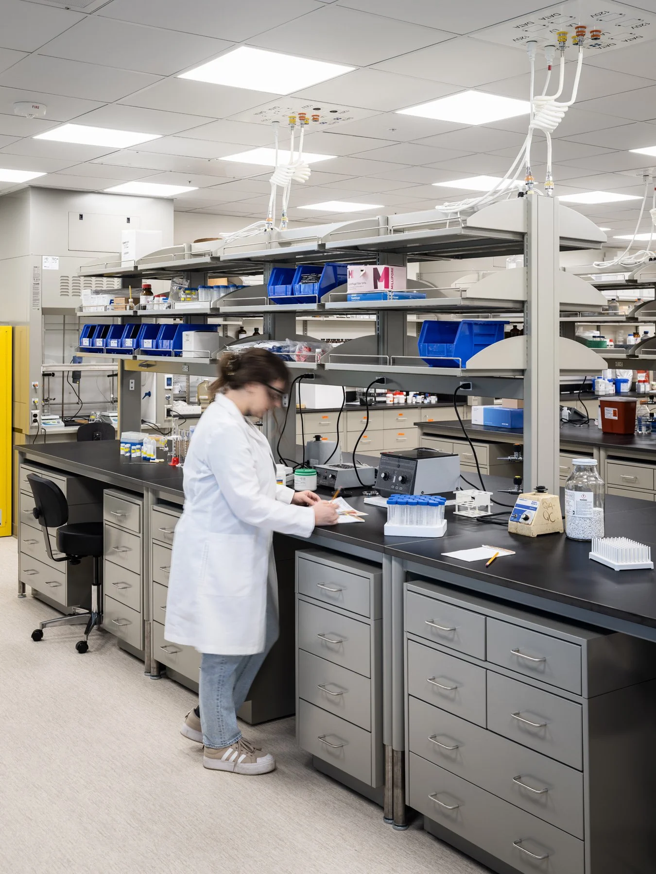 SIUE Health Sciences pharmacy teaching lab with a researcher at a bench by Christner, Edwardsville Illinois - architectural photographer St. Louis