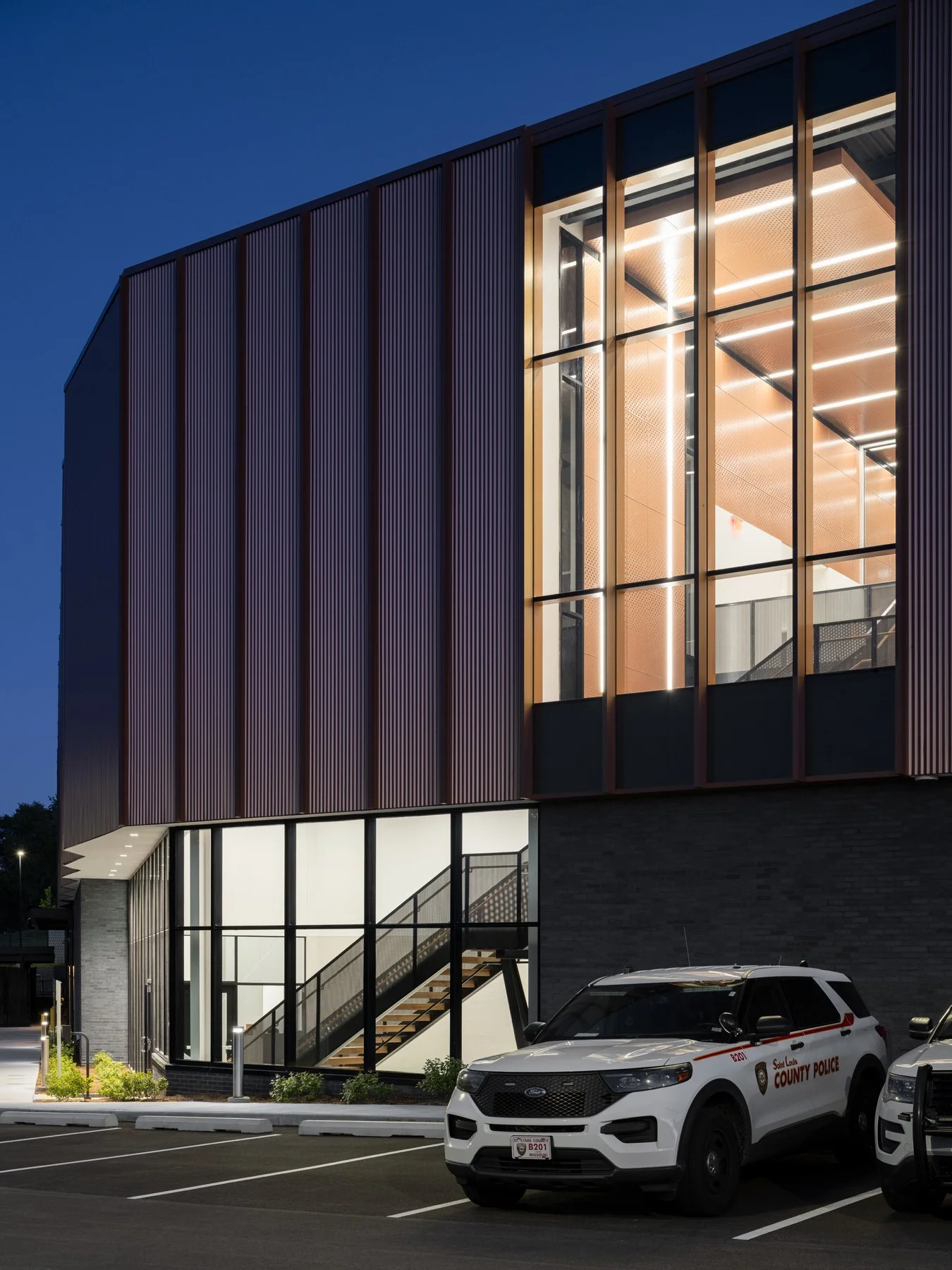Detective Antonio Valentine Building glazed stair wing at dusk by JEMA, Maryland Heights Missouri - architectural photographer St. Louis Missouri