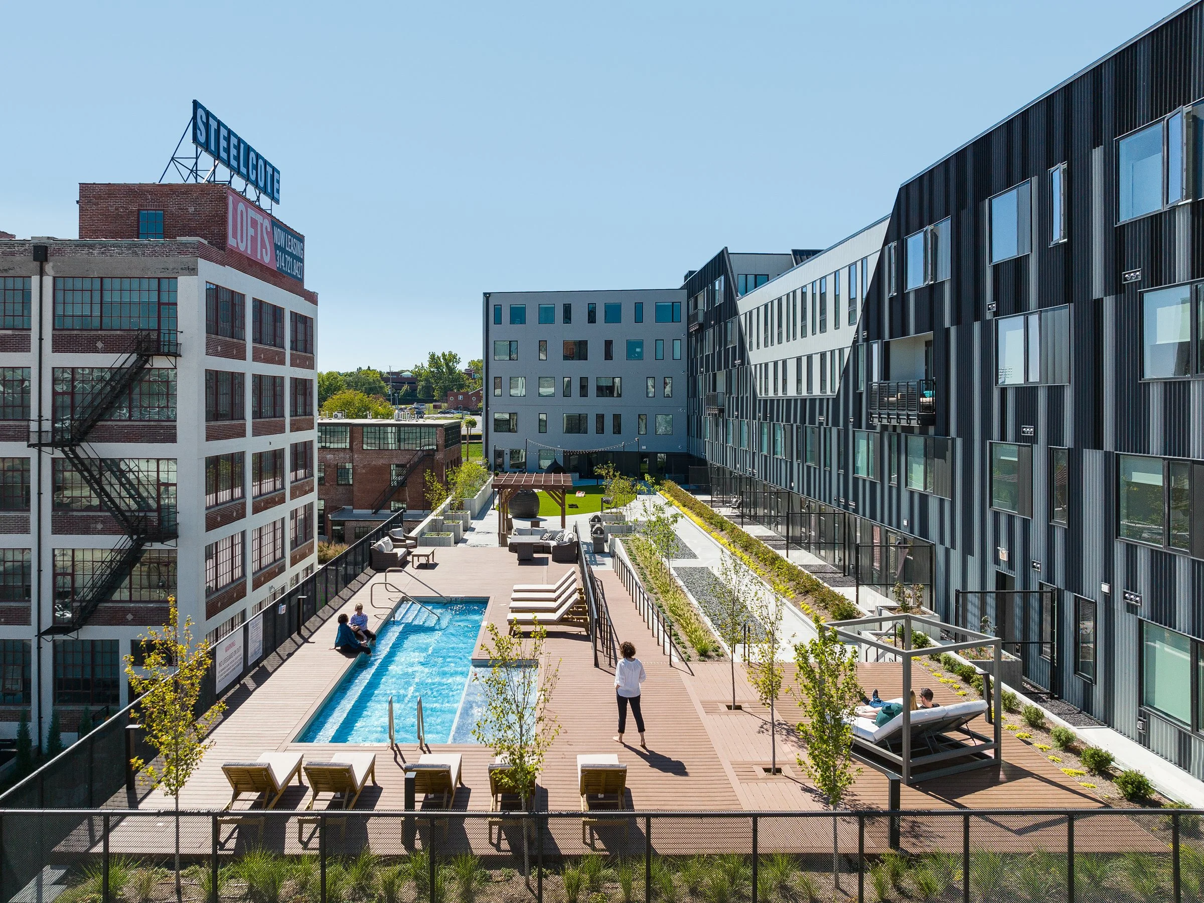 Steelcote Lofts residential building exterior showing rooftop amenity deck by Trivers, St. Louis Missouri