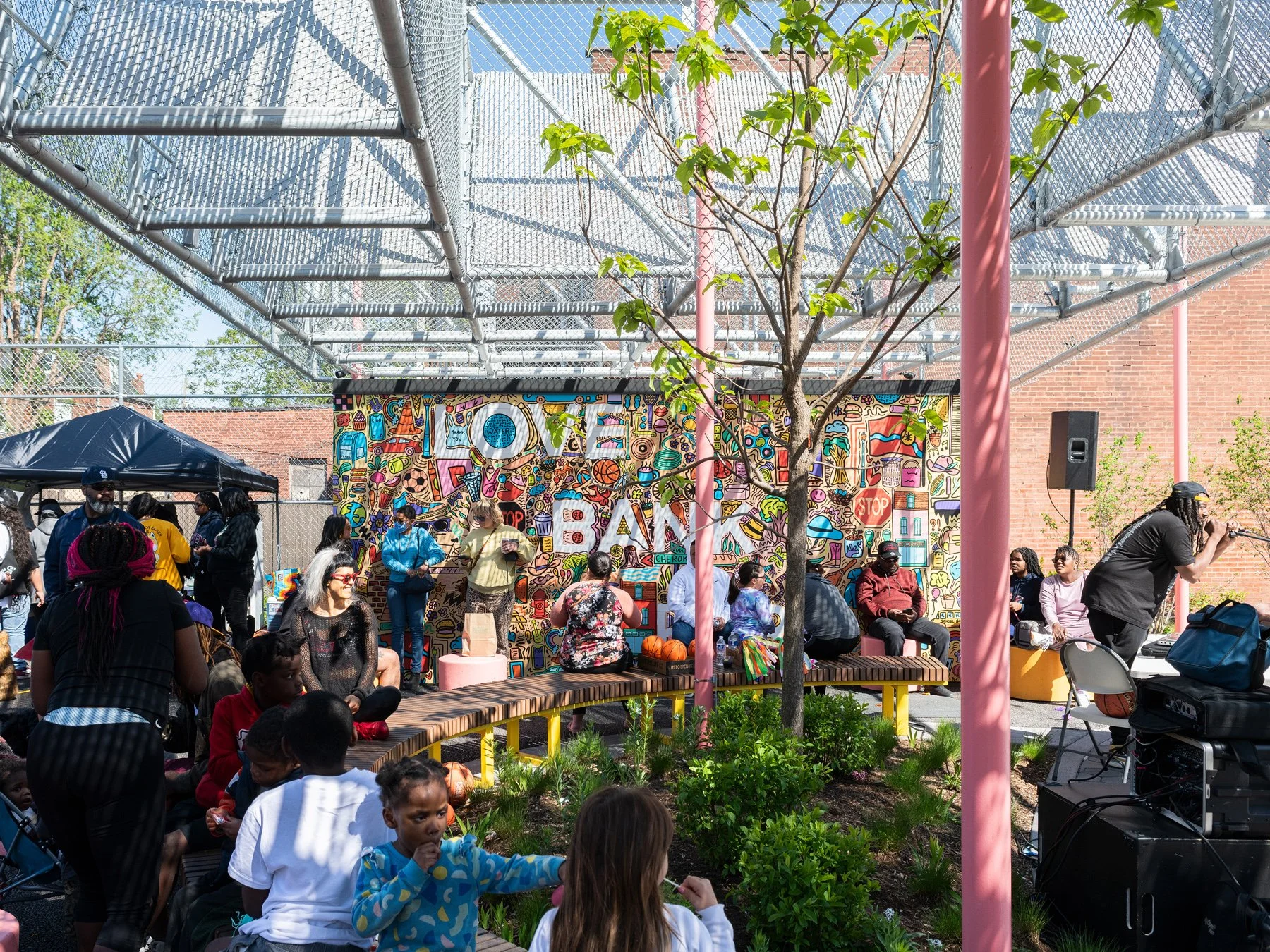 Love Bank Park live event at the curved bench and mural wall, by Patterhn Ives and Arbolope Studio - architectural photographer St. Louis Missouri