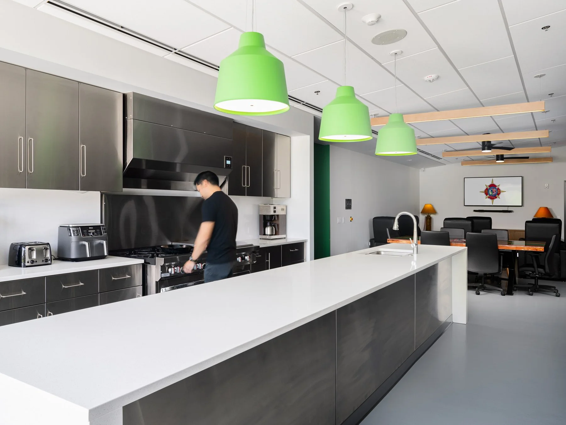 St. Charles fire station interior kitchen with green pendant lights, by JEMA, St. Charles Missouri - architectural photographer St. Louis Missouri