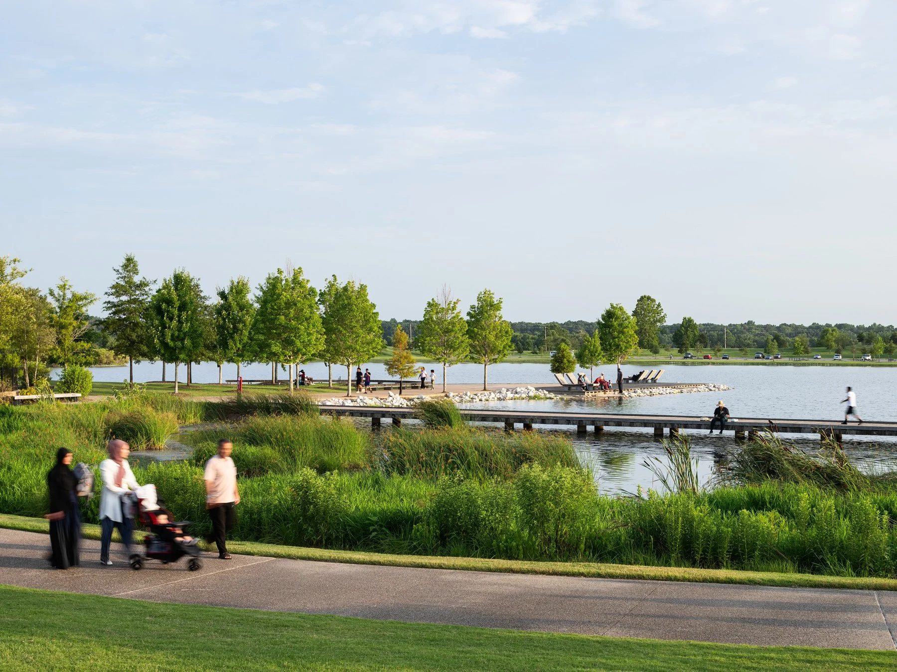 Shelby Farms Park visitors on the path by the wetland, landscape by James Corner Field Operations - architectural photographer Memphis Tennessee