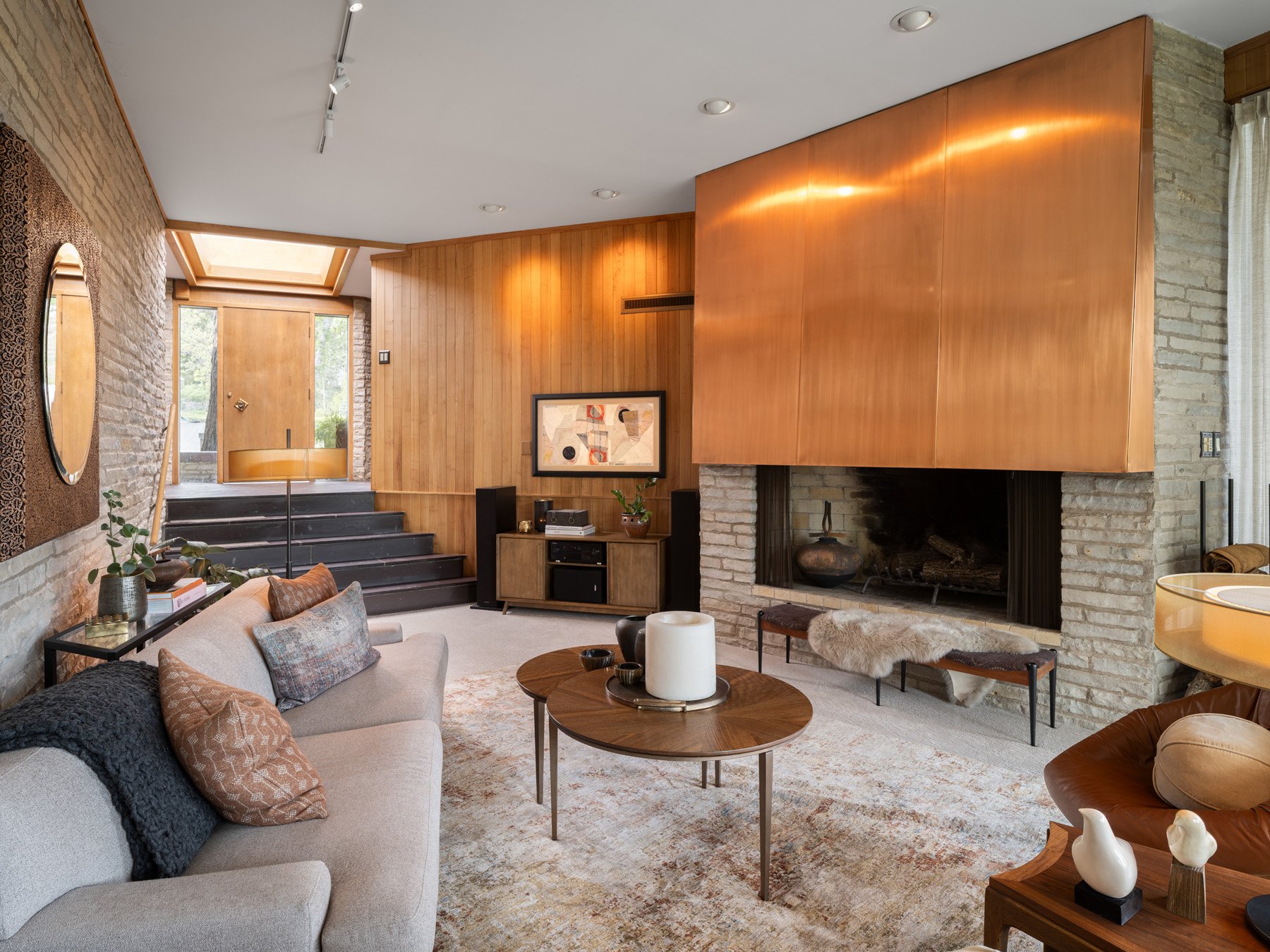 Garrison House living room with copper fireplace hood and wood paneling, Sleepy Hollow Illinois - architectural photographer Chicago