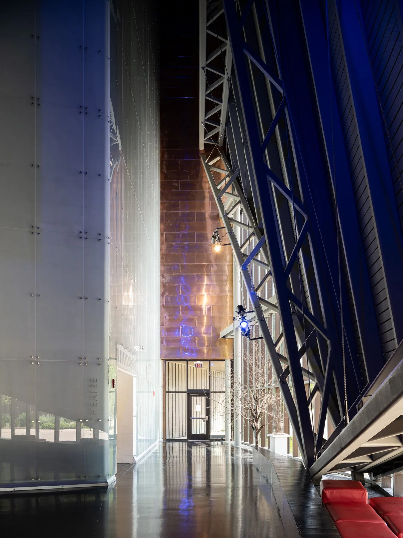 Doudna Fine Arts Center theatre lobby with tall copper wall and canted steel trusses by Antoine Predock, Charleston Illinois - architectural photographer