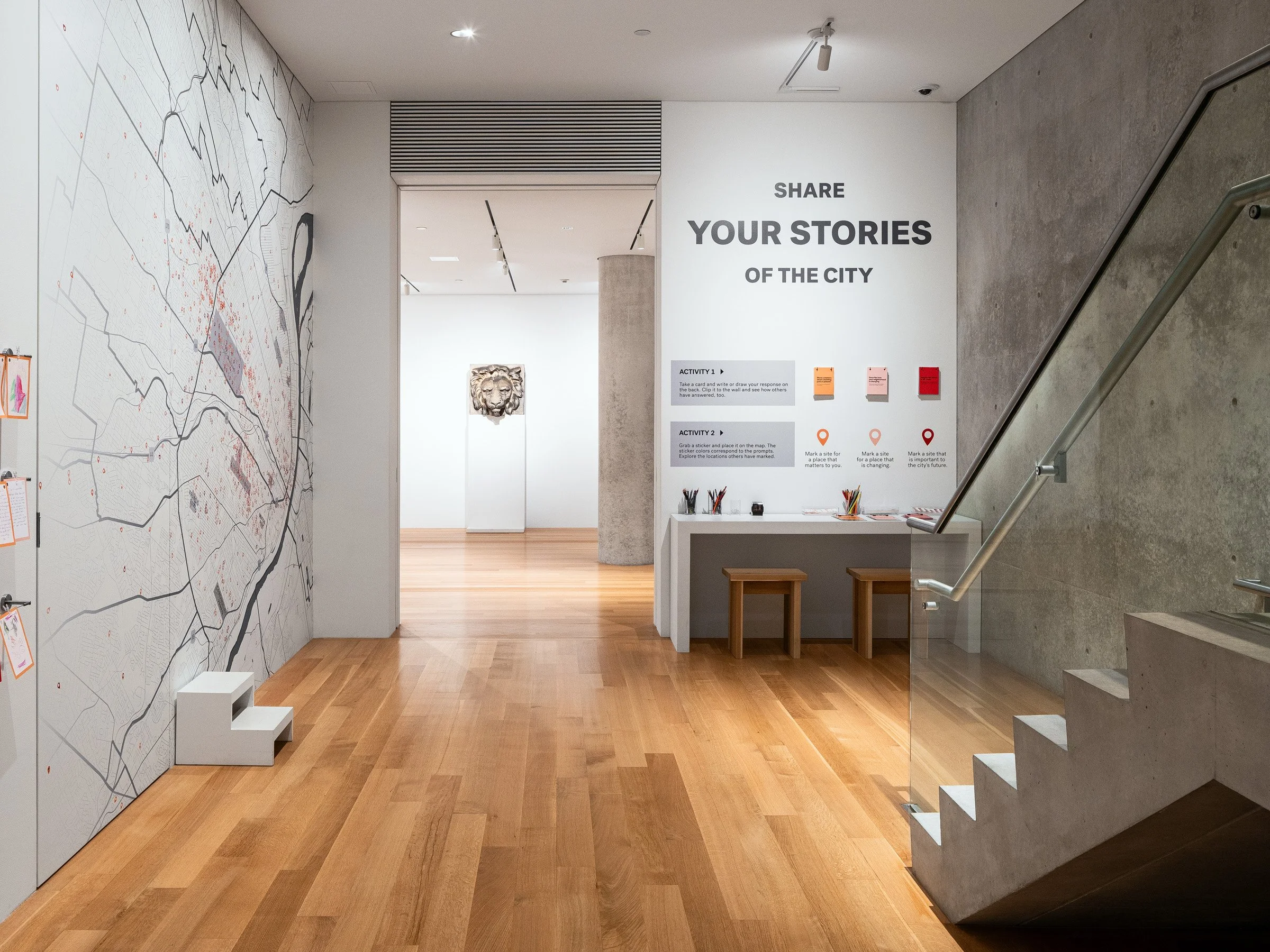 Pulitzer Arts Foundation interior gallery with a city map mural and an interactive Share Your Stories of the City wall beside the concrete stair, by Tadao Ando, St. Louis Missouri - architectural photographer St. Louis Missouri