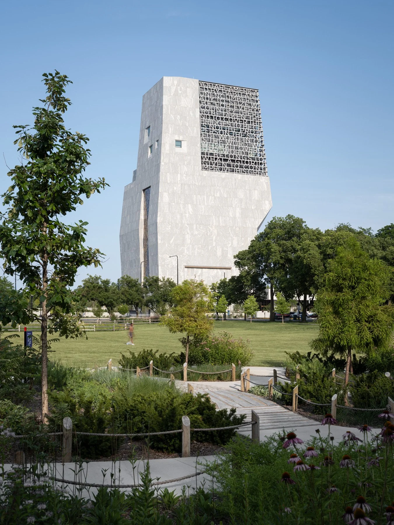 Obama Presidential Center tower above lawn and prairie plantings, landscape by Michael Van Valkenburgh - architectural photographer Chicago Illinois