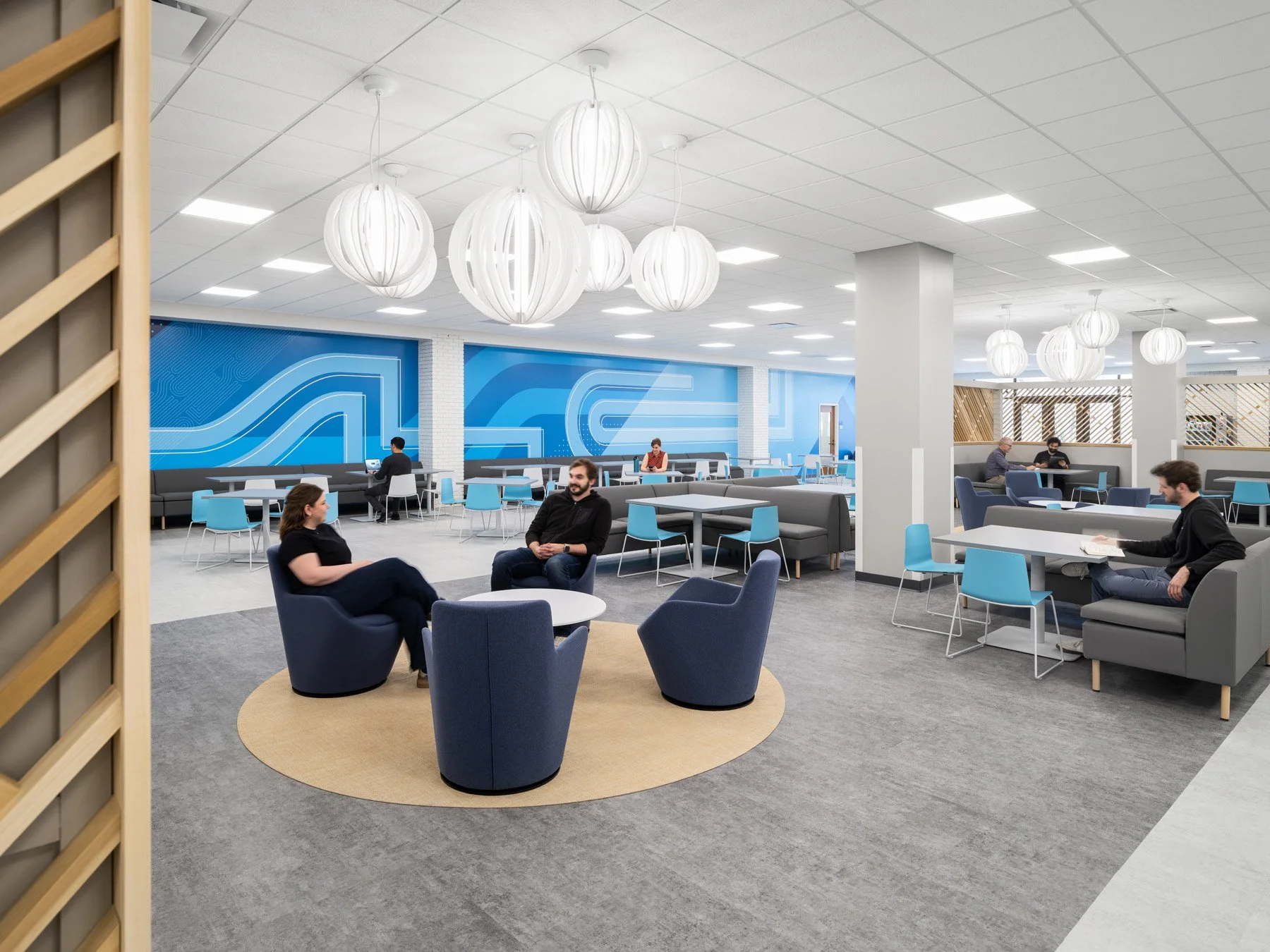 STLCC Florissant Valley Student Center dining lounge with blue graphic mural by JEMA, Ferguson Missouri - architectural photographer St. Louis