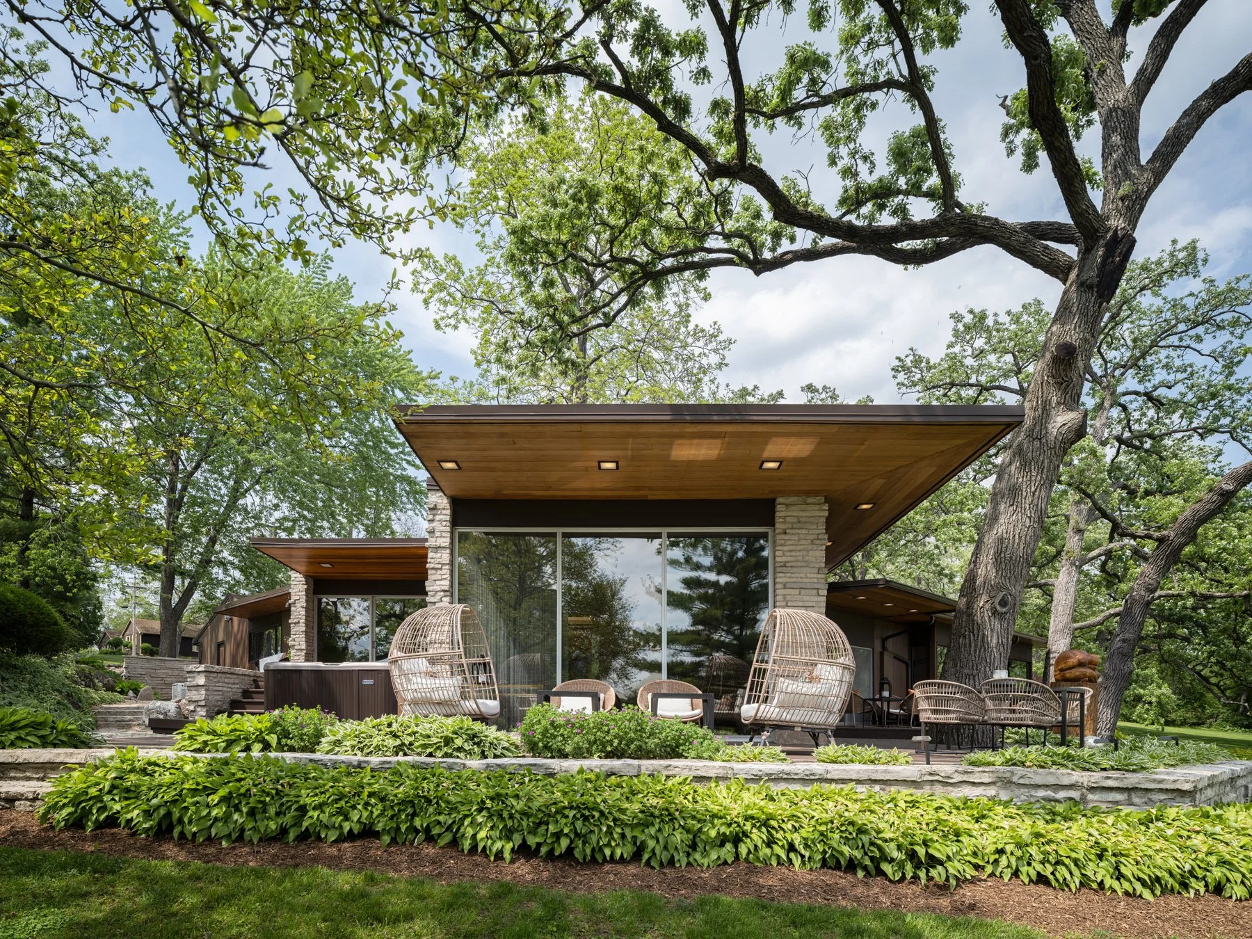 Garrison House garden facade, cantilevered roof over a stone terrace, Sleepy Hollow Illinois - architectural photographer Chicago