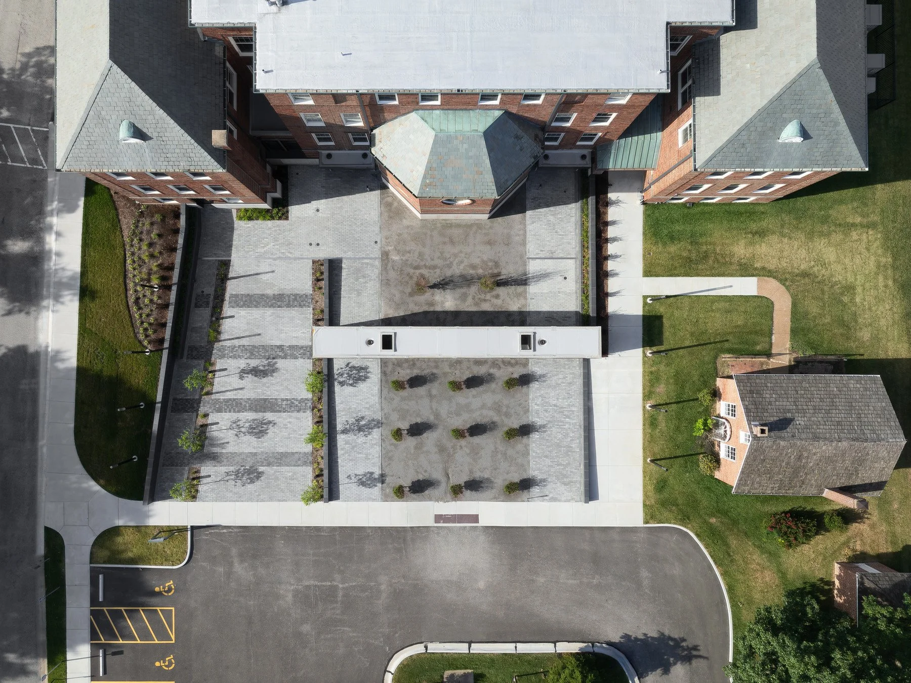 Des Peres City Hall overhead aerial of entry plaza and canopy with copper roof below by Patterhn Ives, Des Peres Missouri - architectural photographer St. Louis
