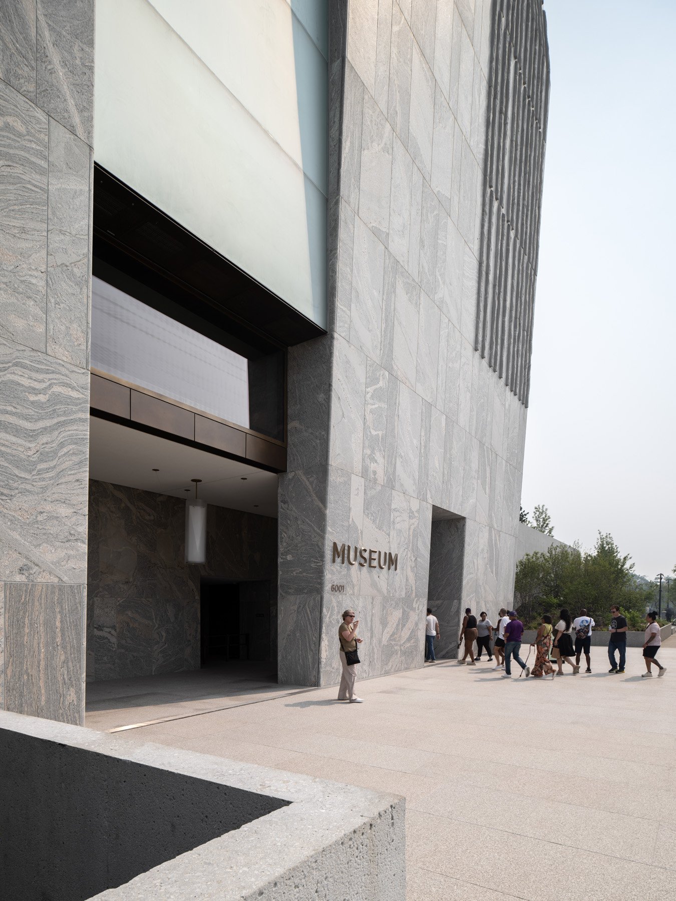 Obama Presidential Center museum entrance and granite soffit, by Tod Williams Billie Tsien - architectural photographer Chicago Illinois