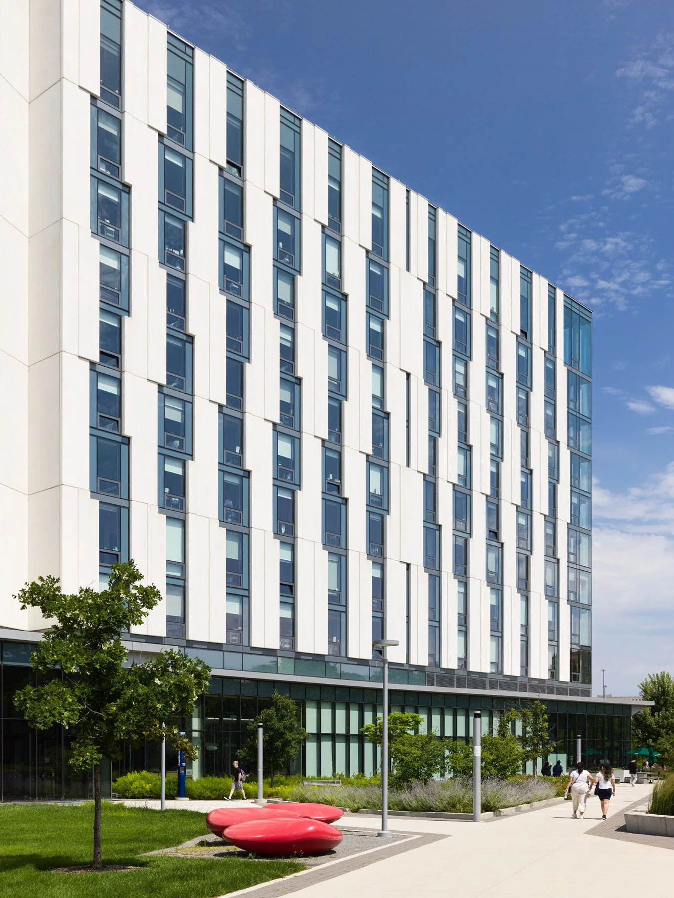 UIC Academic and Residential Complex residence tower and red plaza sculptures, by SCB - architectural photographer Chicago Illinois