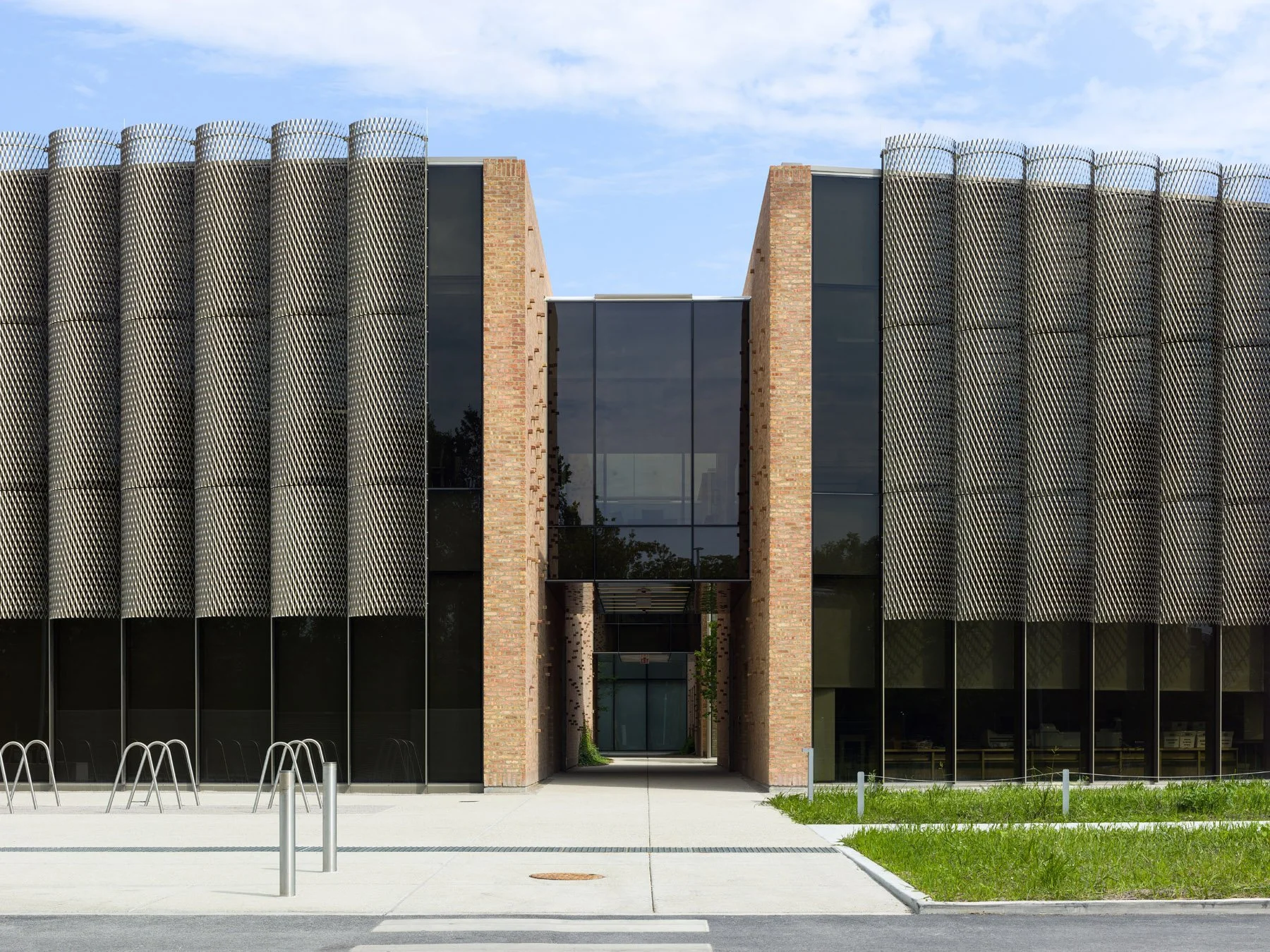 Chicago Park District HQ front facade symmetrical entry portal framed by brick piers and expanded metal screen, by John Ronan Architects - architectural photographer Chicago Illinois