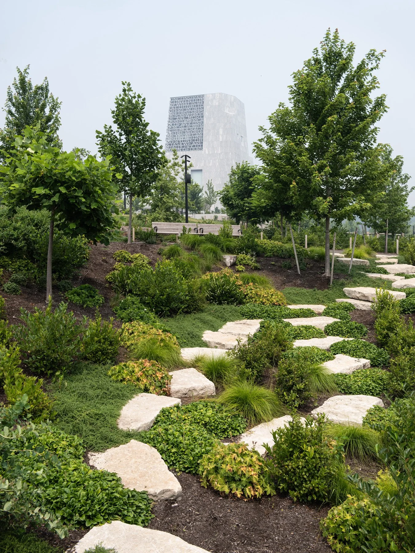 Obama Presidential Center stone path through hillside plantings, landscape by Michael Van Valkenburgh - architectural photographer Chicago Illinois