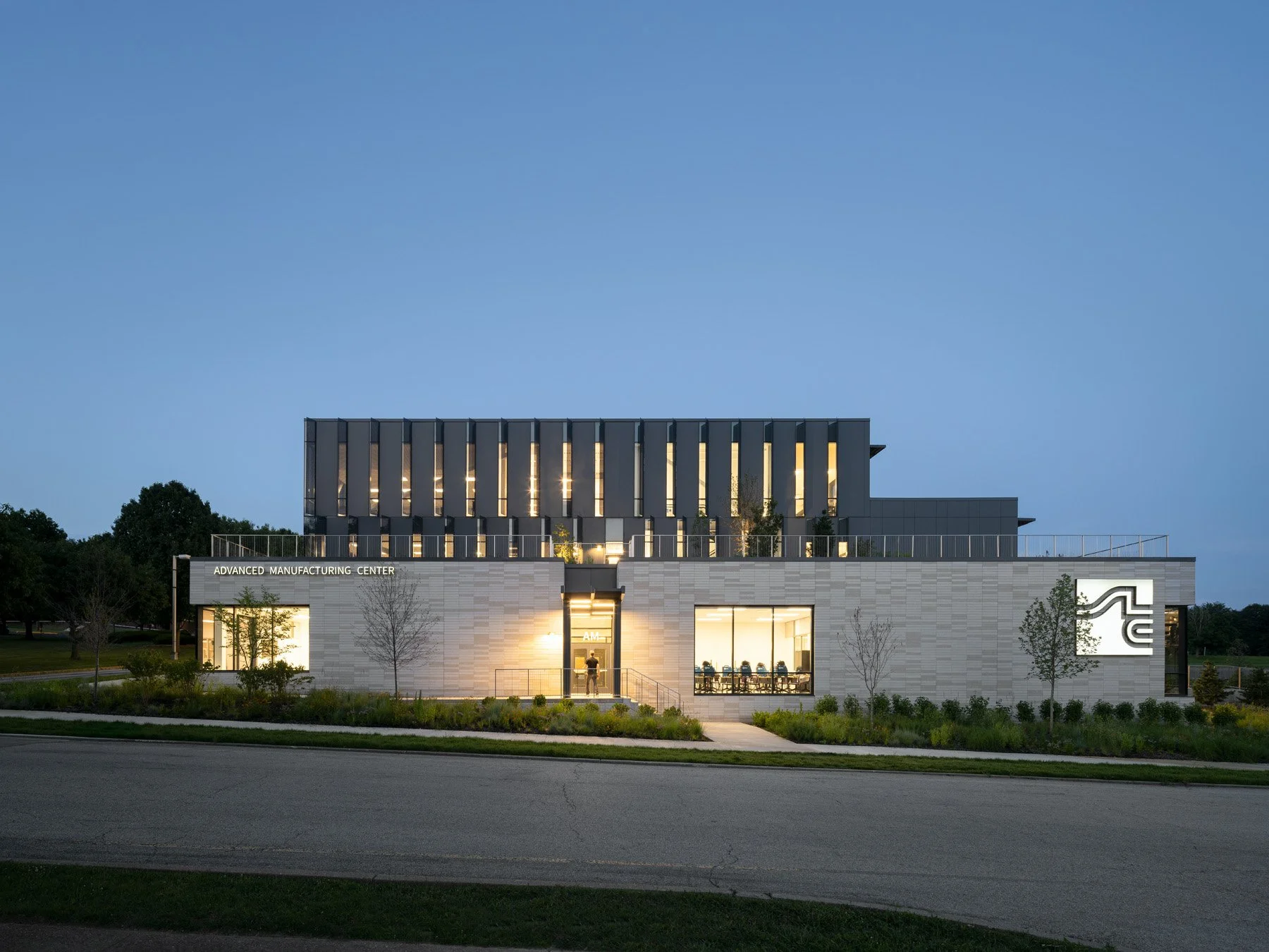 STLCC Florissant Valley Advanced Manufacturing Center street elevation at twilight by JEMA - architectural photographer St. Louis Missouri