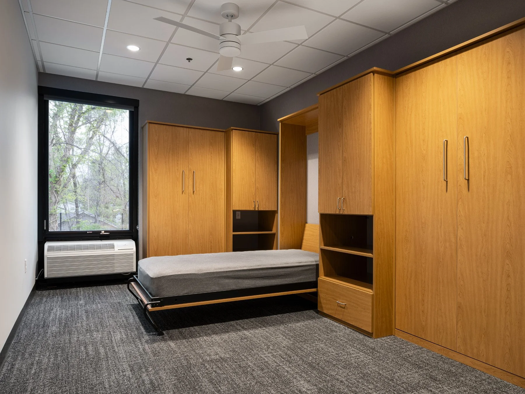 St. Charles fire station interior bunk room with a murphy bed, by JEMA, St. Charles Missouri - architectural photographer St. Louis Missouri