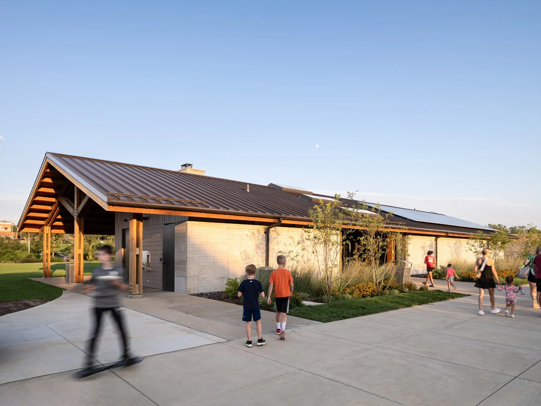 Brentwood Park Event Pavilion north facade at dusk, solar panels on standing-seam roof, by Christner - architectural photographer St. Louis Missouri