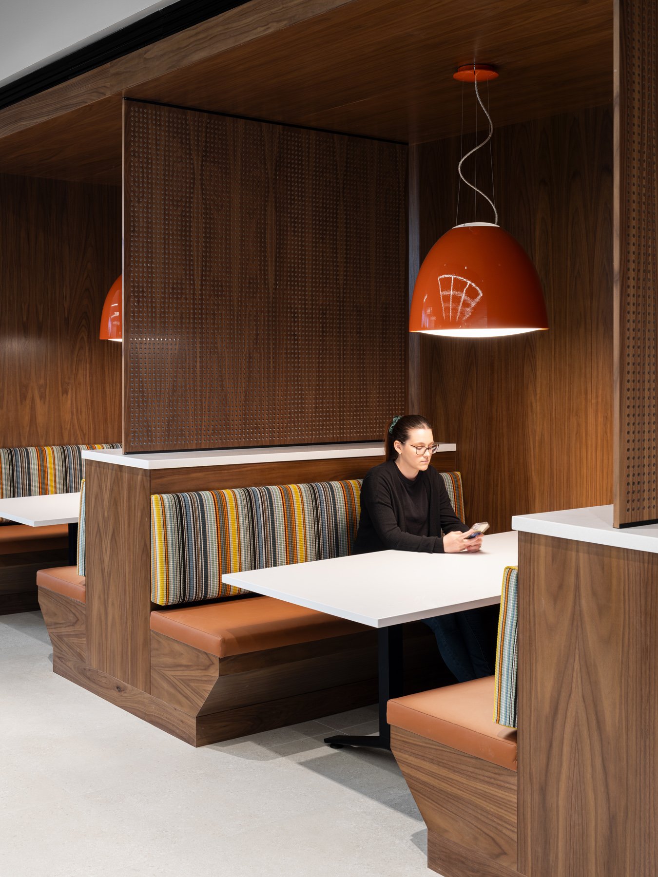 Detective Antonio Valentine Building interior wood booth seating by JEMA, Maryland Heights Missouri - architectural photographer St. Louis Missouri