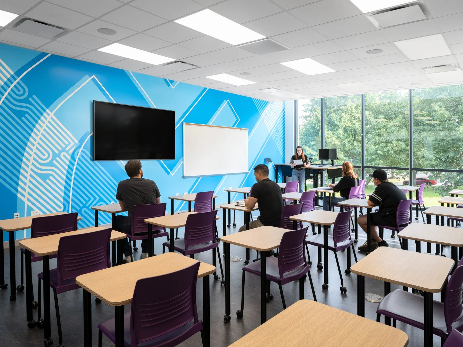 STLCC Florissant Valley Advanced Manufacturing Center classroom with blue graphic mural by JEMA - architectural photographer St. Louis Missouri