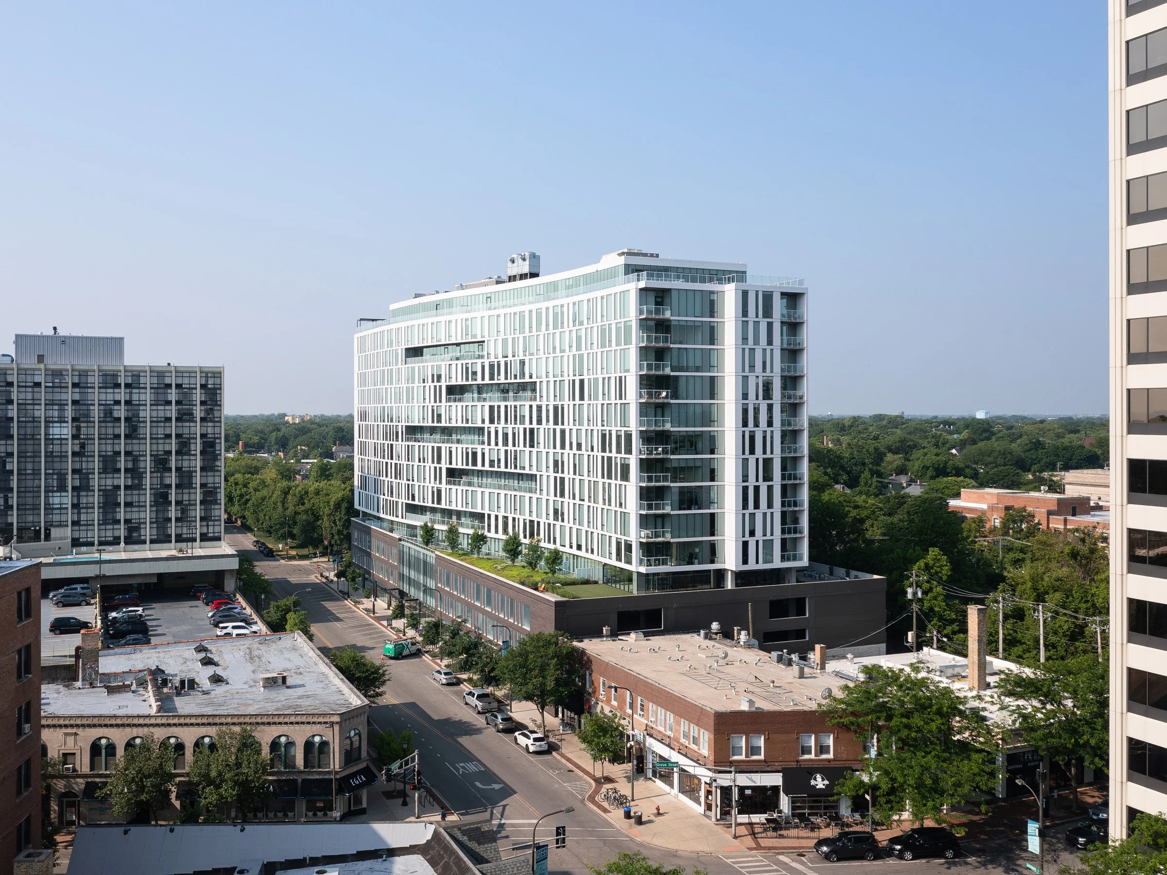 Albion Evanston exterior elevated view of the 15-story mass within downtown Evanston above surrounding low-rise blocks, by Hartshorne Plunkard Architecture, Evanston Illinois - architectural photographer Chicago Illinois