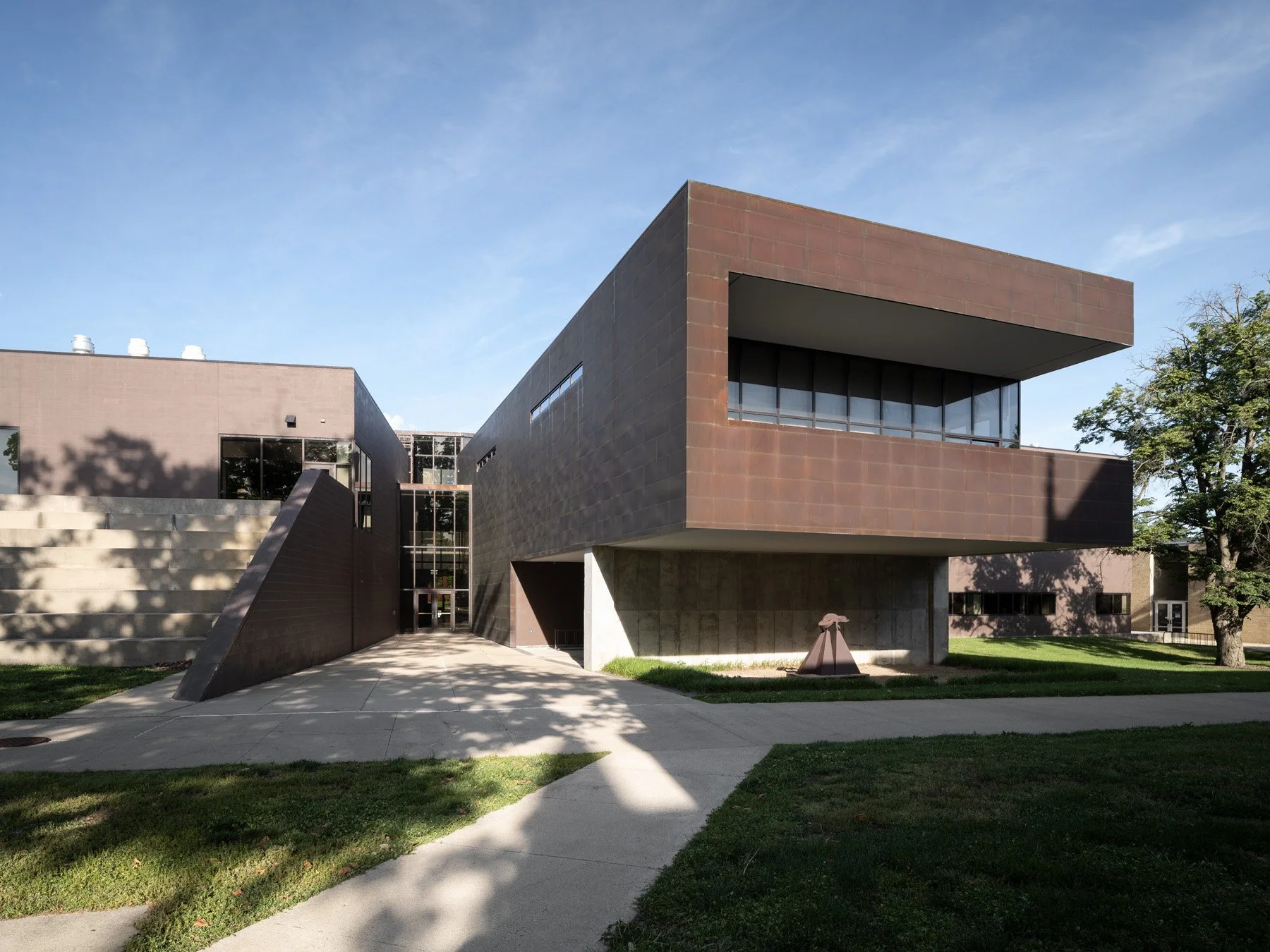 Doudna Fine Arts Center exterior cantilevered copper-clad volume over a concrete base at the entry by Antoine Predock, Charleston Illinois