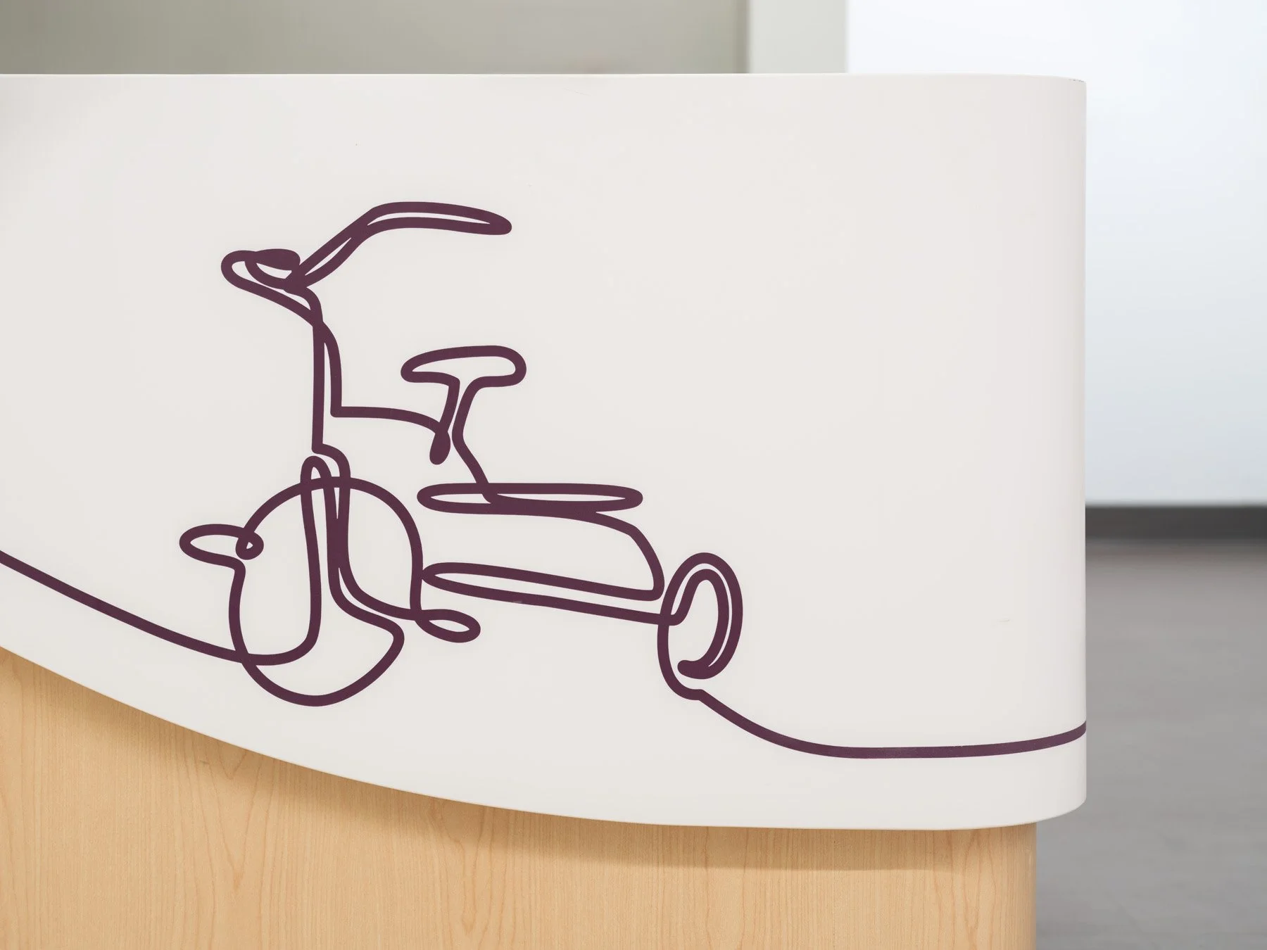 St. Louis Children’s Hospital nurse station desk with tricycle line drawing, by CannonDesign - architectural photographer St. Louis Missouri