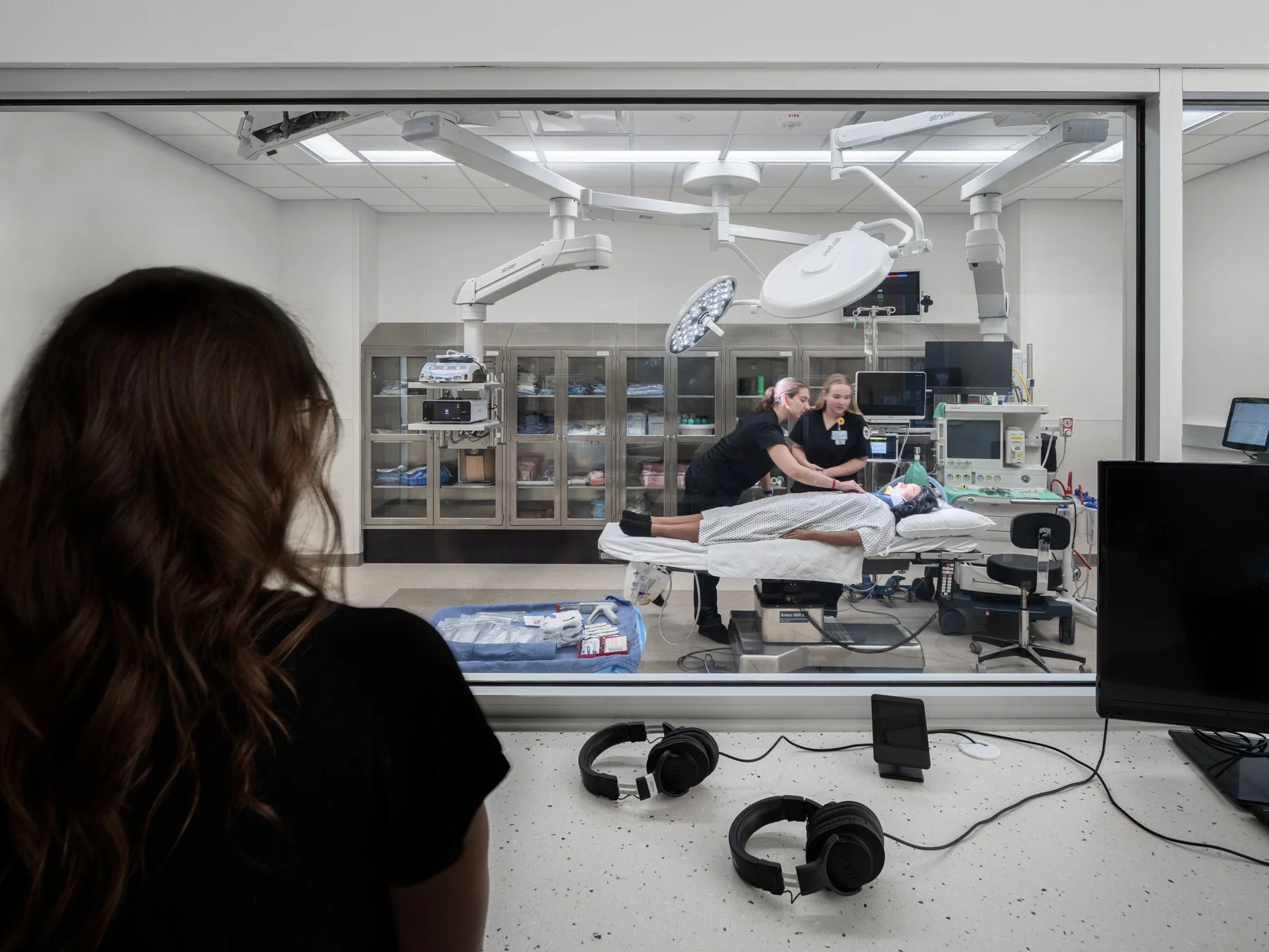 SIUE Health Sciences surgical simulation suite seen through an observation window by Christner, Edwardsville Illinois - architectural photographer St. Louis