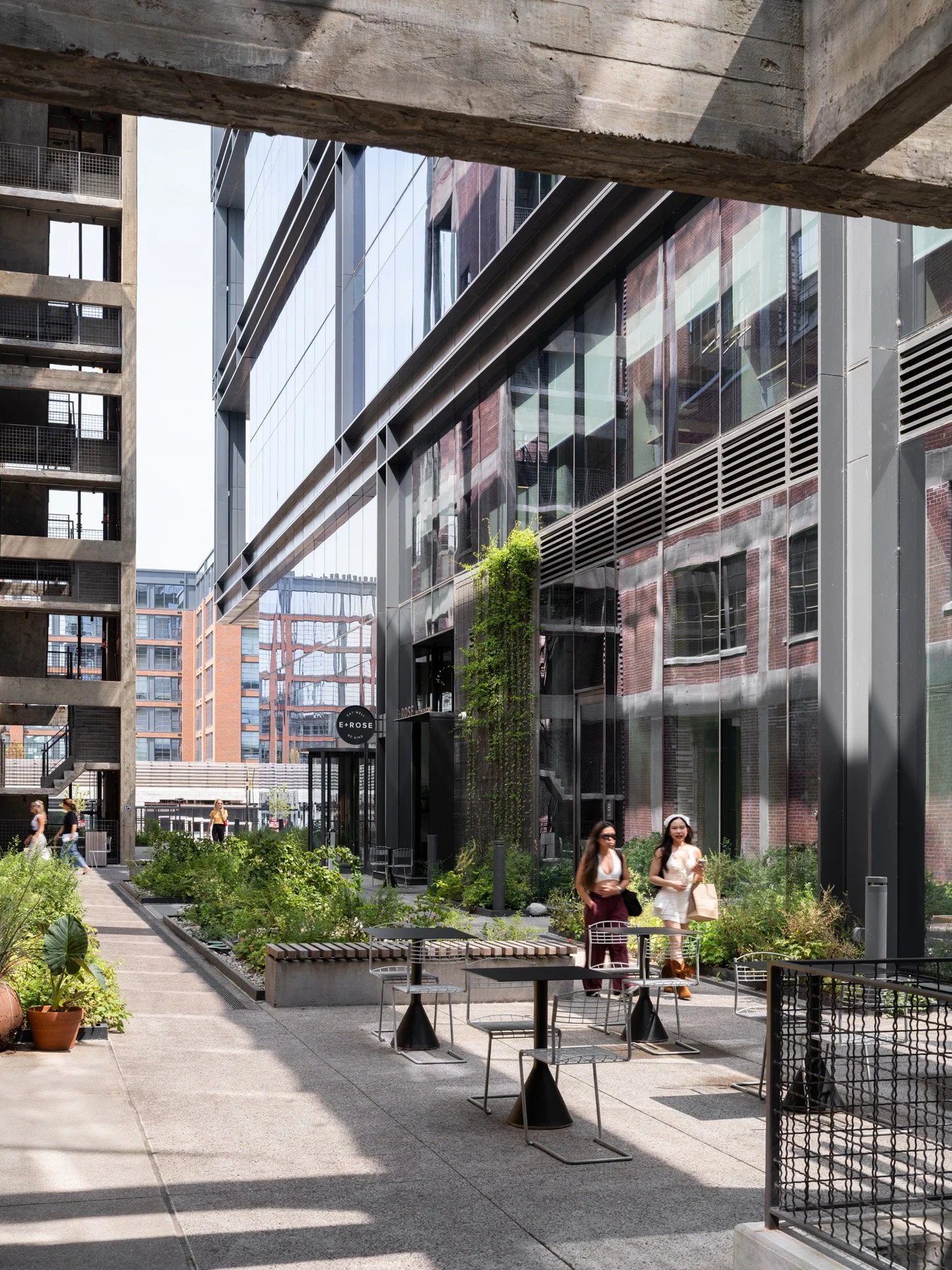 Neuhoff District alley garden with cafe tables under the tower, landscape by Future Green Studio - architectural photographer Nashville Tennessee