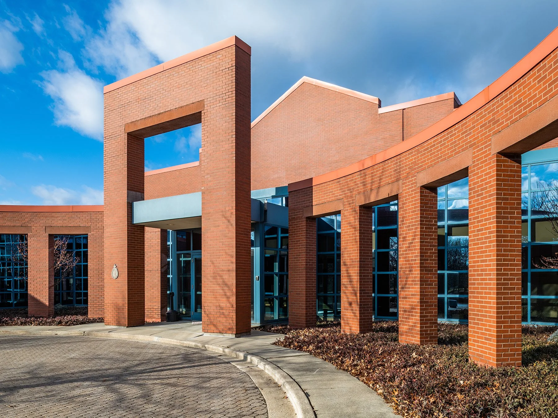 Catholic Order of Foresters exterior curving brick arcade by Holabird & Root, Naperville Illinois - architectural photographer Chicago
