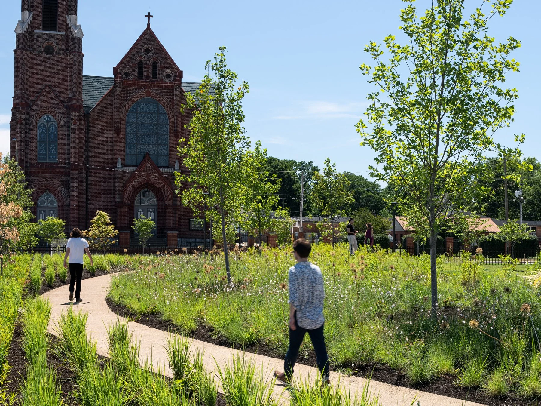 Carillon Park prairie planting and path by a historic brick church, landscape by Arbolope Studio - architectural photographer Centralia Illinois